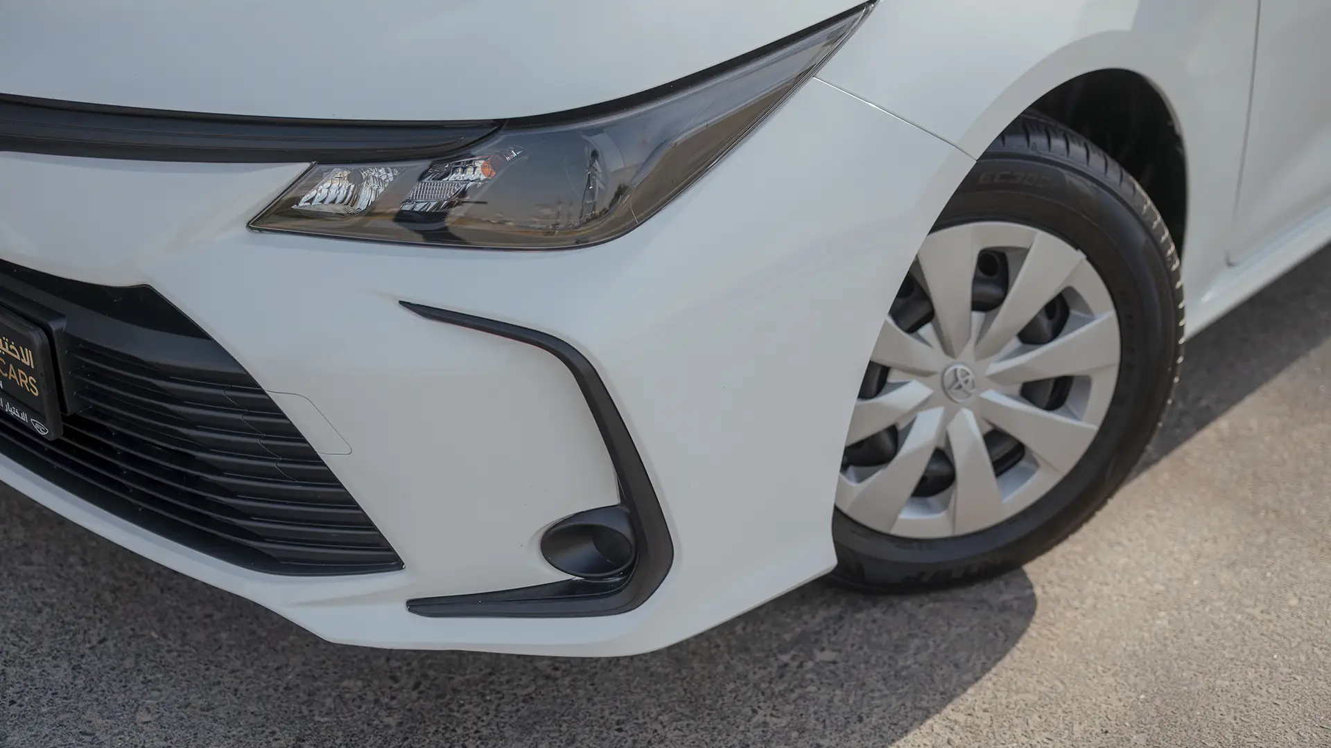 Used 2024 Toyota Corolla XLI in White – Headlight Close-up for Sale at First Choice Cars Dubai Sharjah