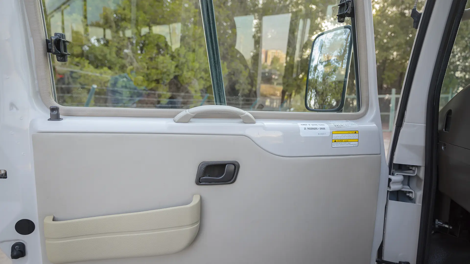 Used 2023 Mitsubishi Rosa Standard in White – Driver Door Panel Full View for Sale at First Choice Cars Dubai Sharjah