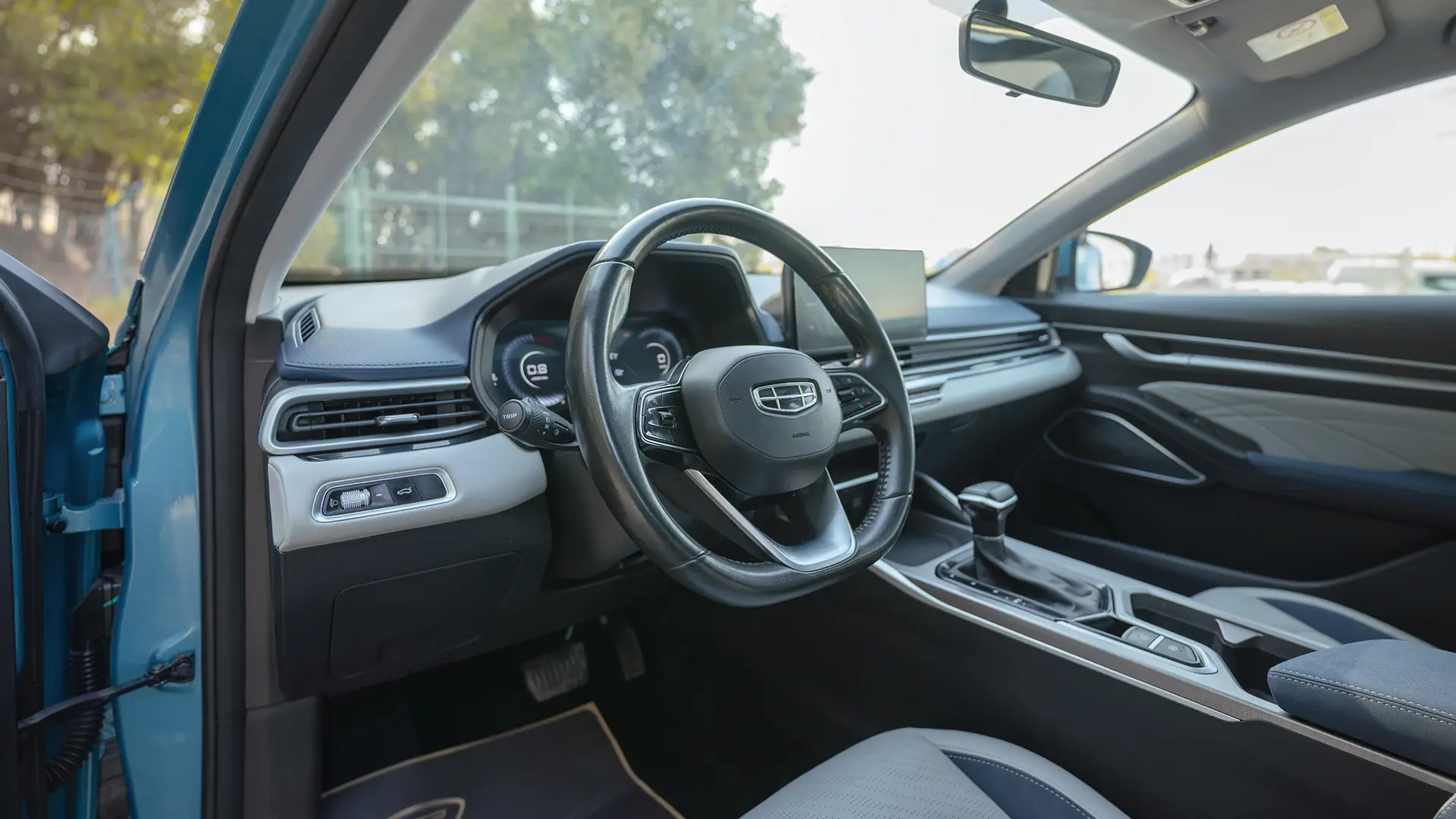 Used 2024 Geely Emgrand GF in Blue – Driver Side Dashboard & Steering View for Sale at First Choice Cars Dubai Sharjah