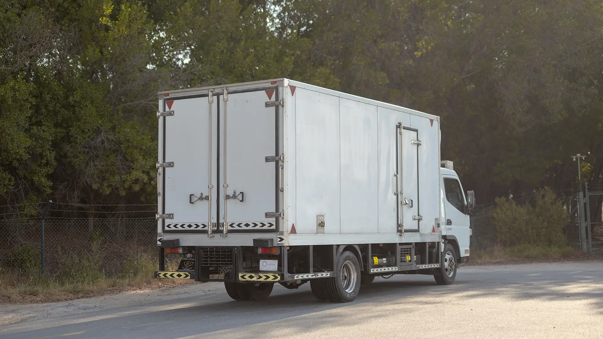 Used 2022 Mitsubishi Canter Chiller Box in White – Right Back Diagonal (45°) View for Sale at First Choice Cars Dubai Sharjah
