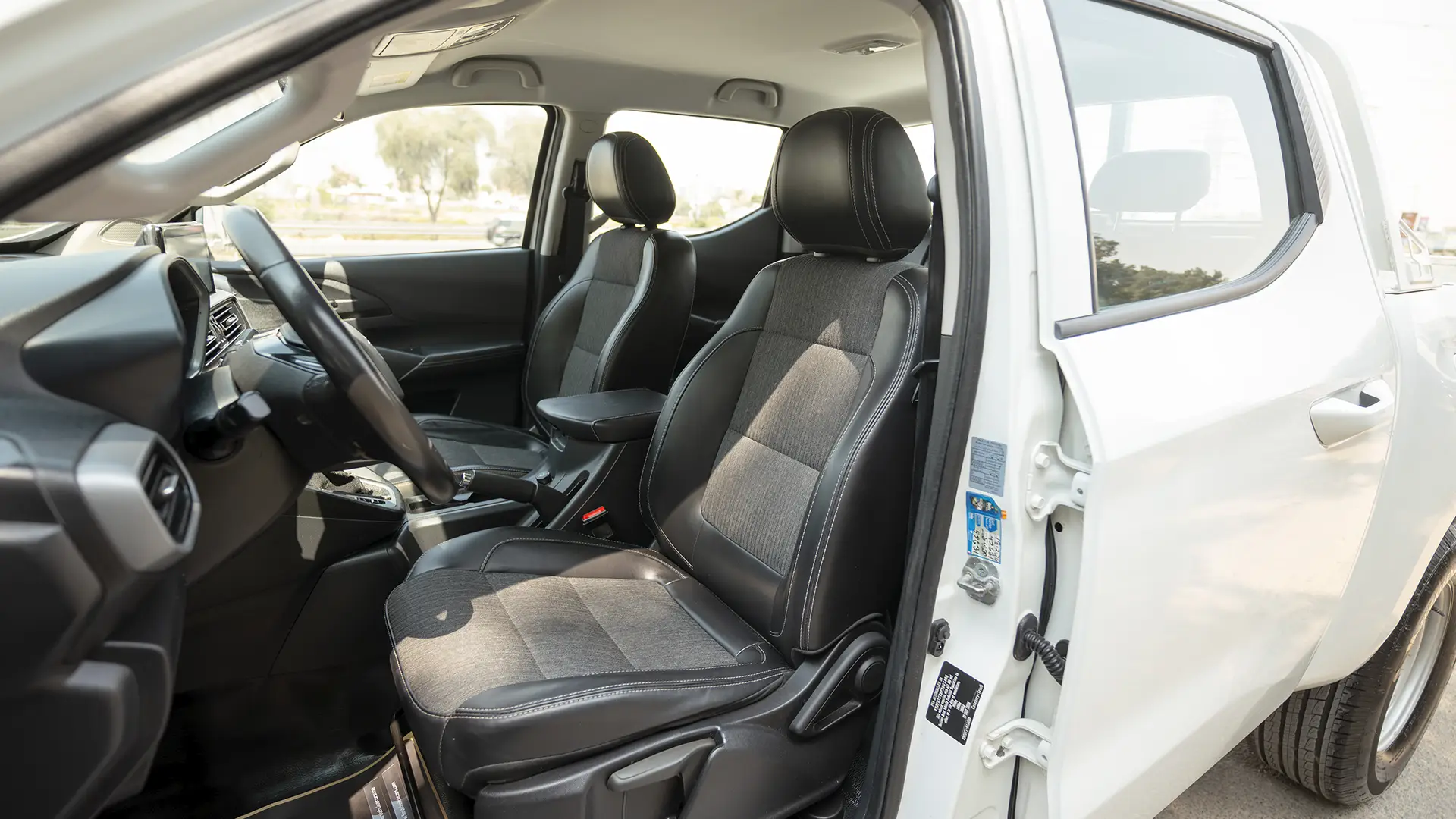 Used 2023 Peugeot Landtrek Double Cabin in White – Front Driver Side Cabin View for Sale at First Choice Cars Dubai Sharjah