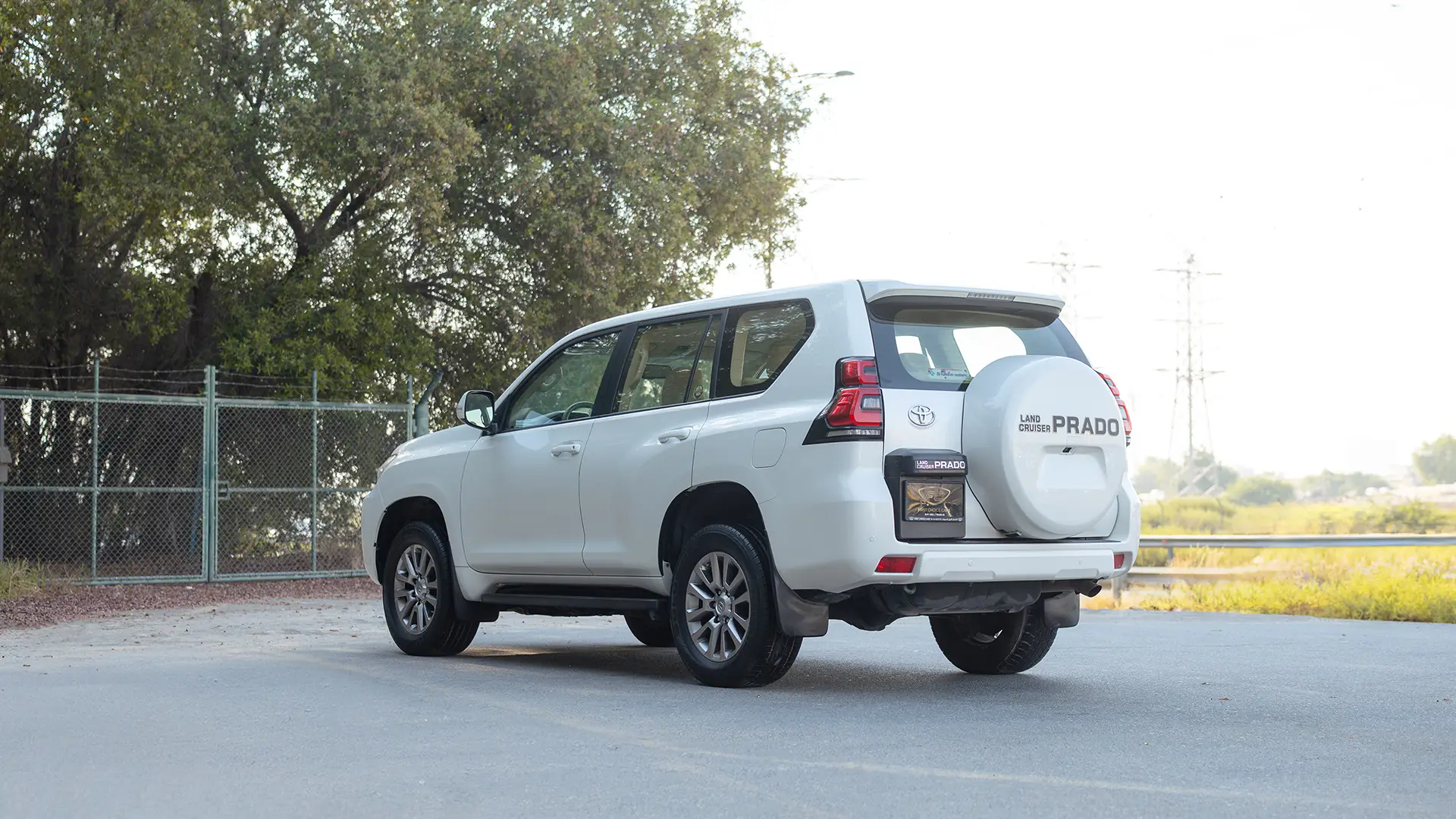 Used 2019 Toyota Prado EXR in White – Left Back Diagonal (45°) View for Sale at First Choice Cars Dubai Sharjah