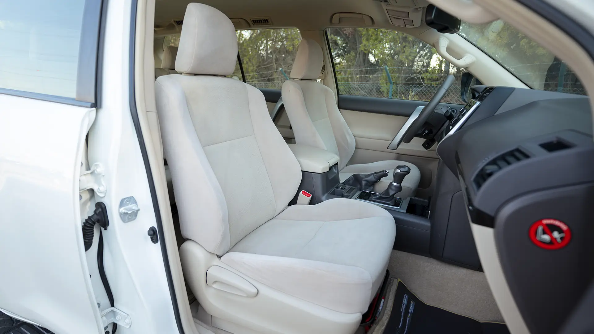 Used 2019 Toyota Prado EXR in White – Front Passenger Side Cabin View for Sale at First Choice Cars Dubai Sharjah