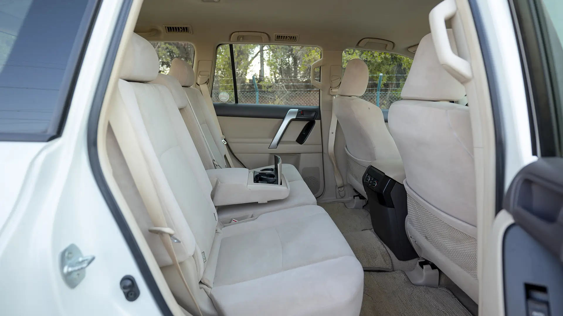 Used 2019 Toyota Prado EXR in White – Rear Passenger Side Cabin View for Sale at First Choice Cars Dubai Sharjah