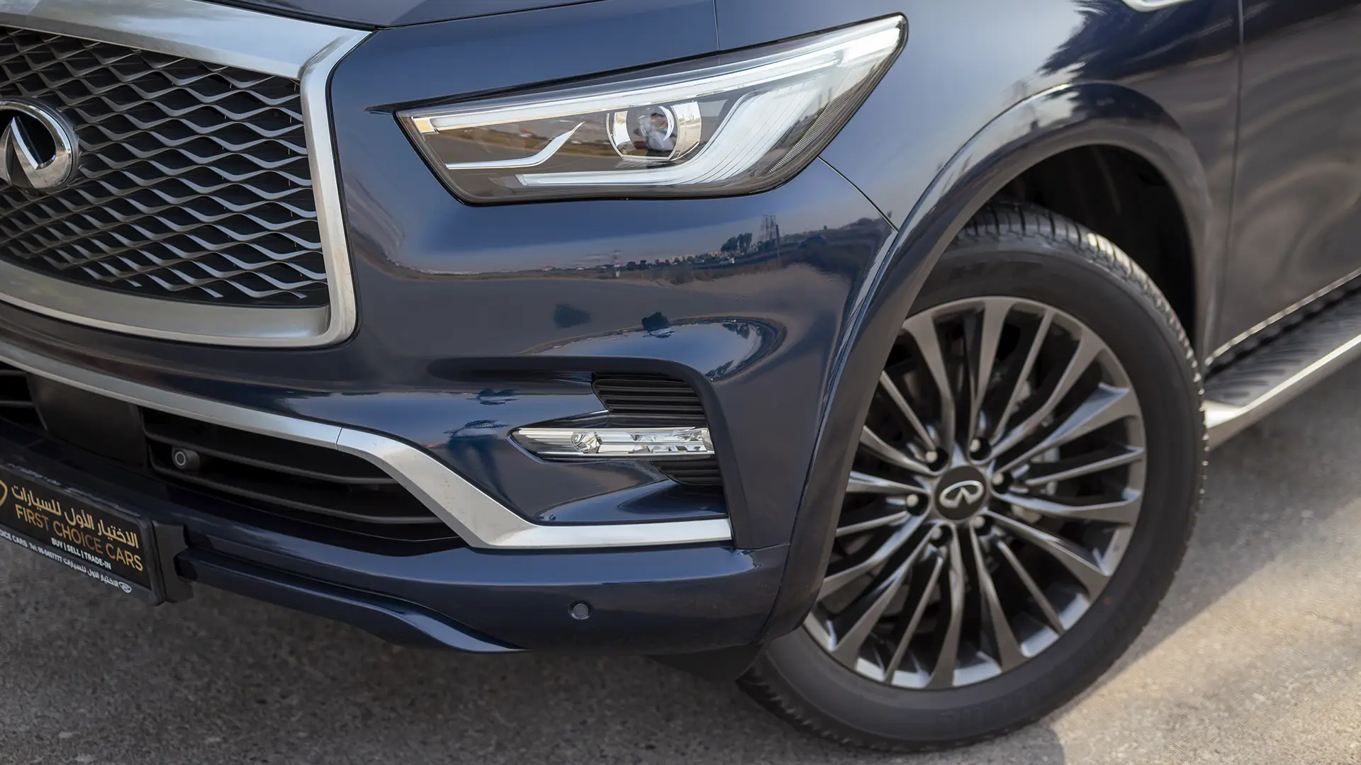 Used 2024 Infiniti QX80 Luxury in Blue – Headlight Close-up for Sale at First Choice Cars Dubai Sharjah