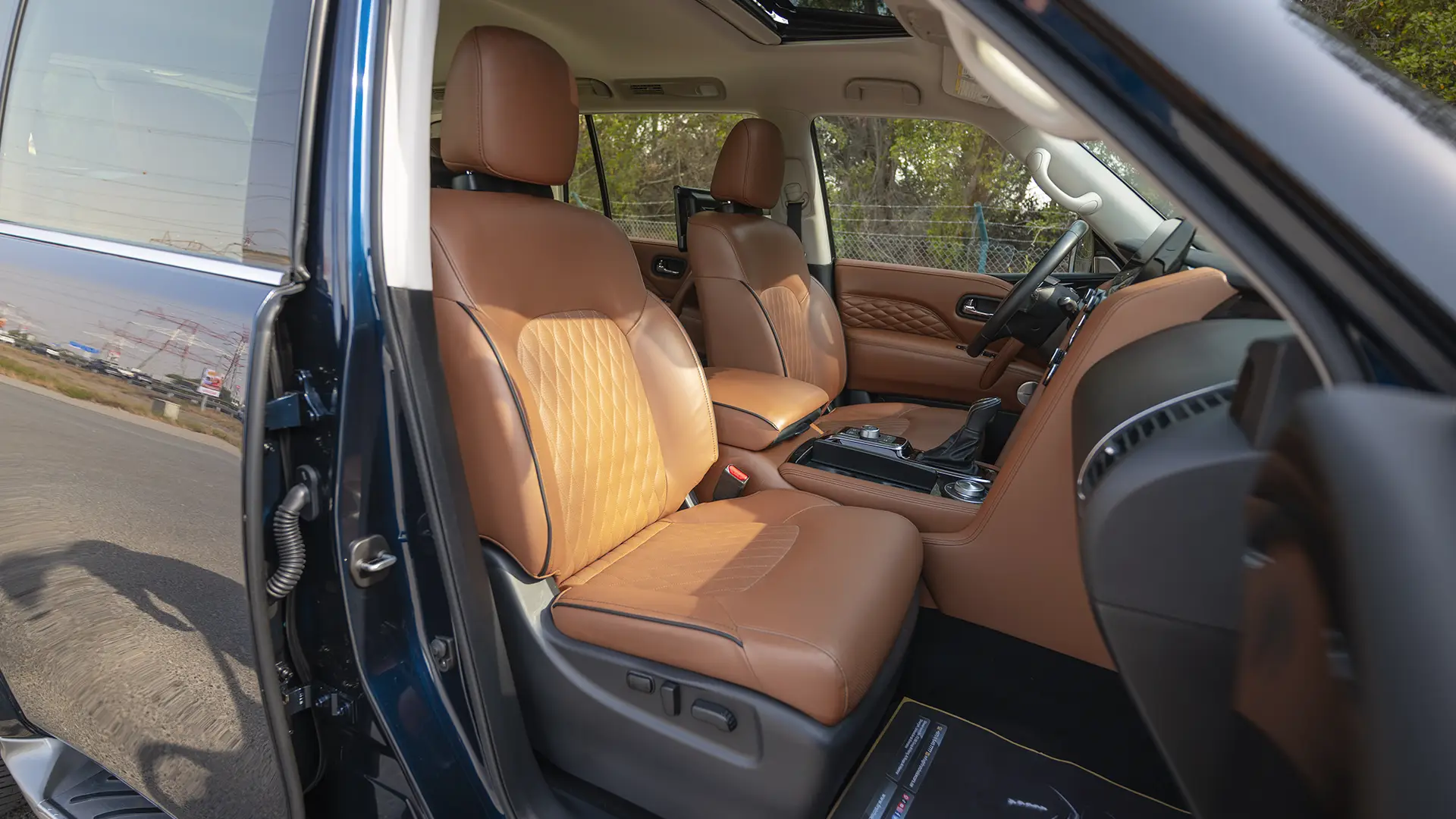 Used 2024 Infiniti QX80 Luxury in Blue – Front Passenger Side Cabin View for Sale at First Choice Cars Dubai Sharjah