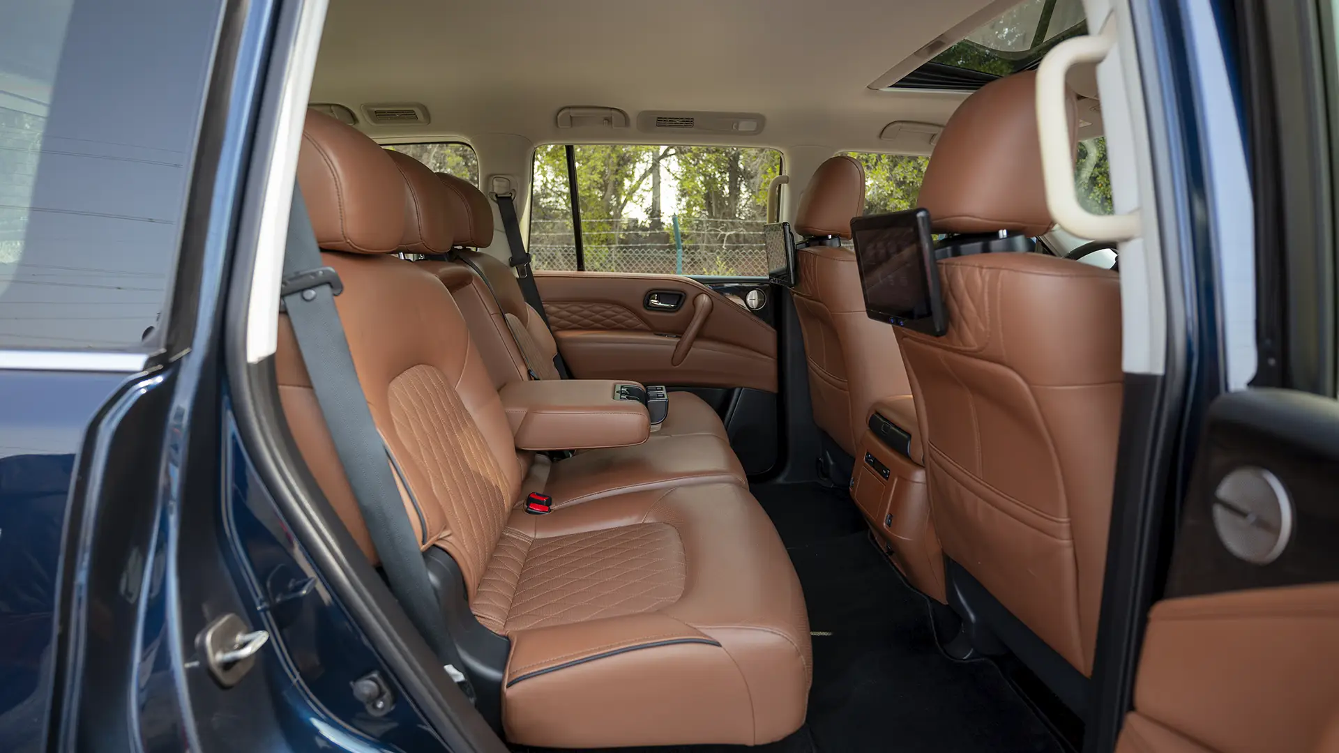 Used 2024 Infiniti QX80 Luxury in Blue – Rear Passenger Side Cabin View for Sale at First Choice Cars Dubai Sharjah