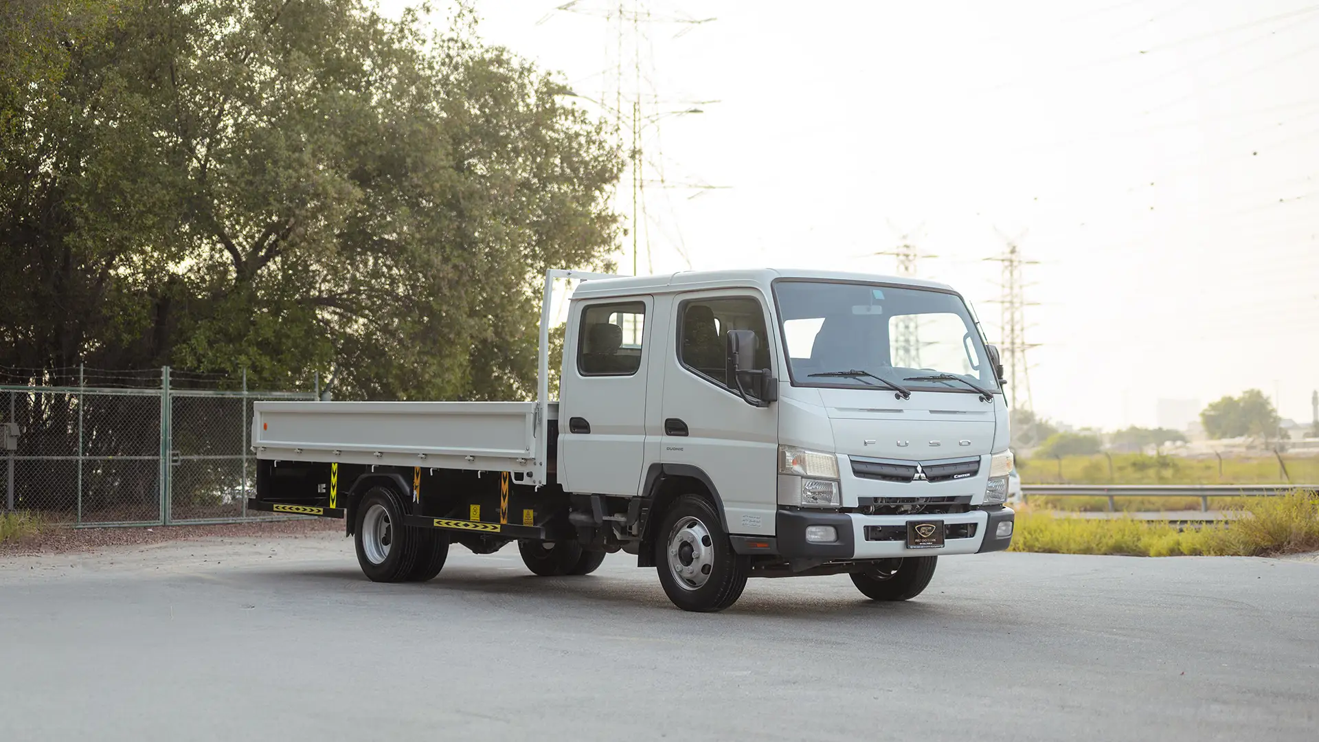 Used 2024 Mitsubishi Canter Double Cabin Cargo Body in White – Right Front Diagonal (45°) View for Sale at First Choice Cars Dubai Sharjah
