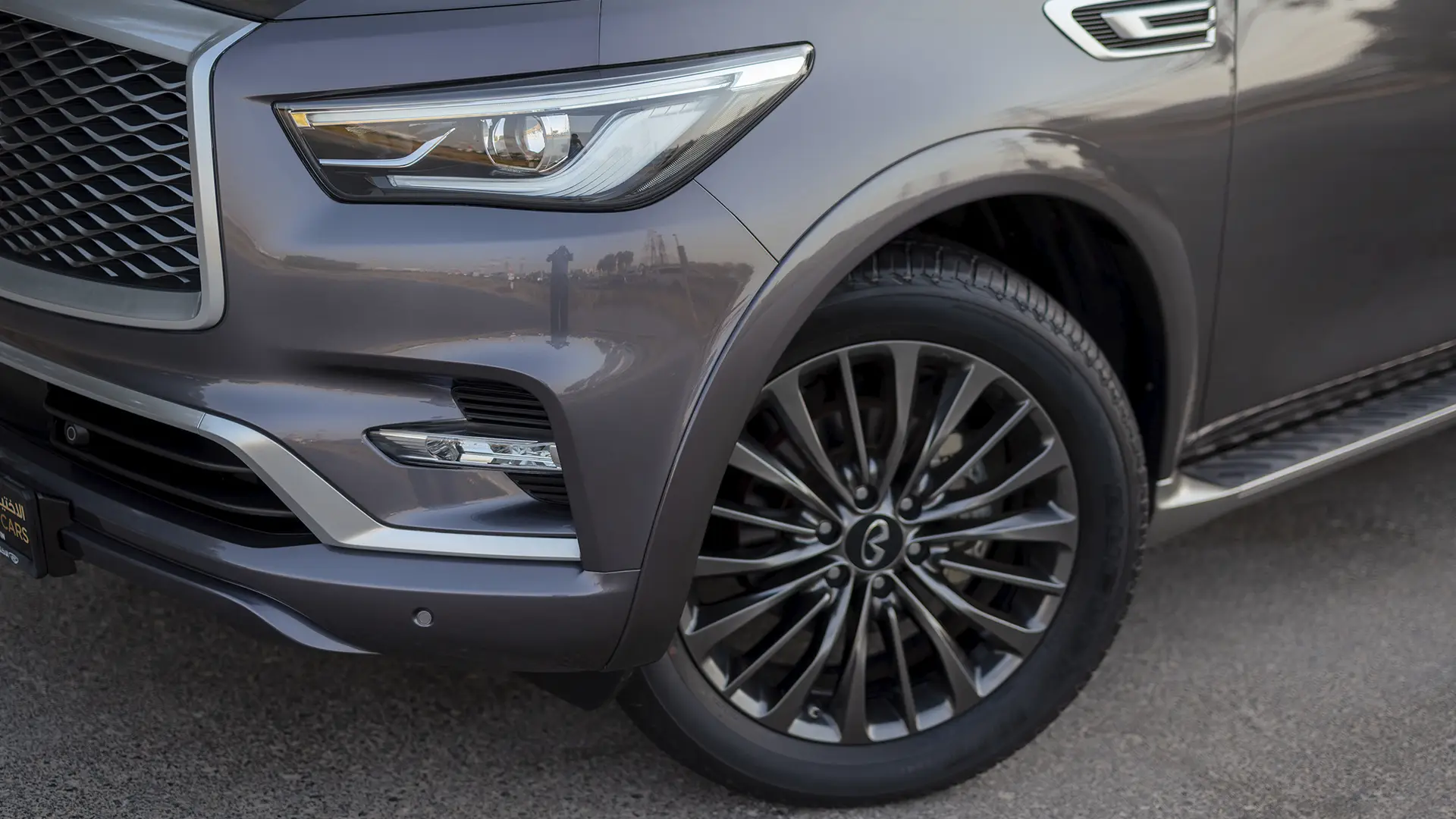 Used 2023 Infiniti QX80 Sensory in Grey – Headlight Close-up for Sale at First Choice Cars Dubai Sharjah