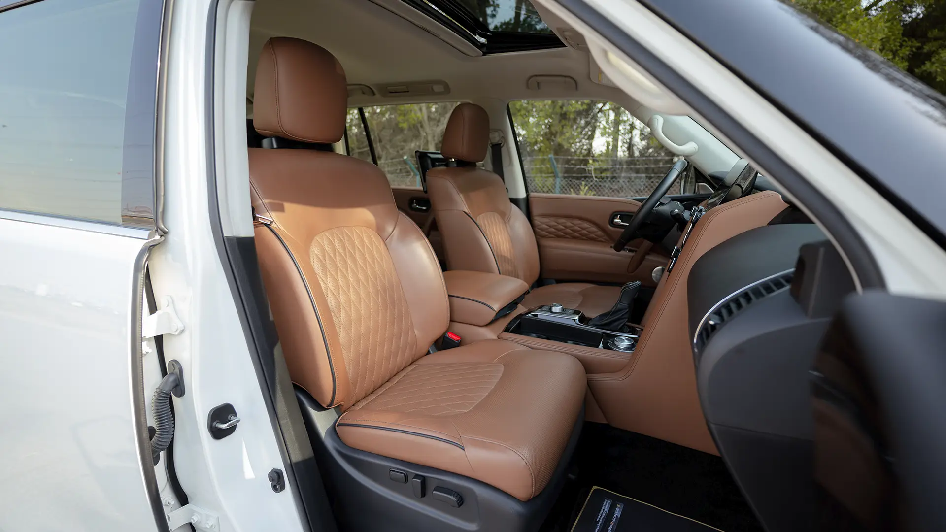 Used 2023 Infiniti QX80 Sensory in White – Front Passenger Side Cabin View for Sale at First Choice Cars Dubai Sharjah