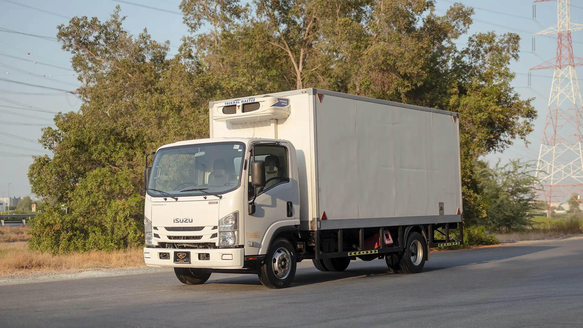 Used 2023 Isuzu Reward Chiller in White – Left Front Diagonal (45°) View for Sale at First Choice Cars Dubai Sharjah