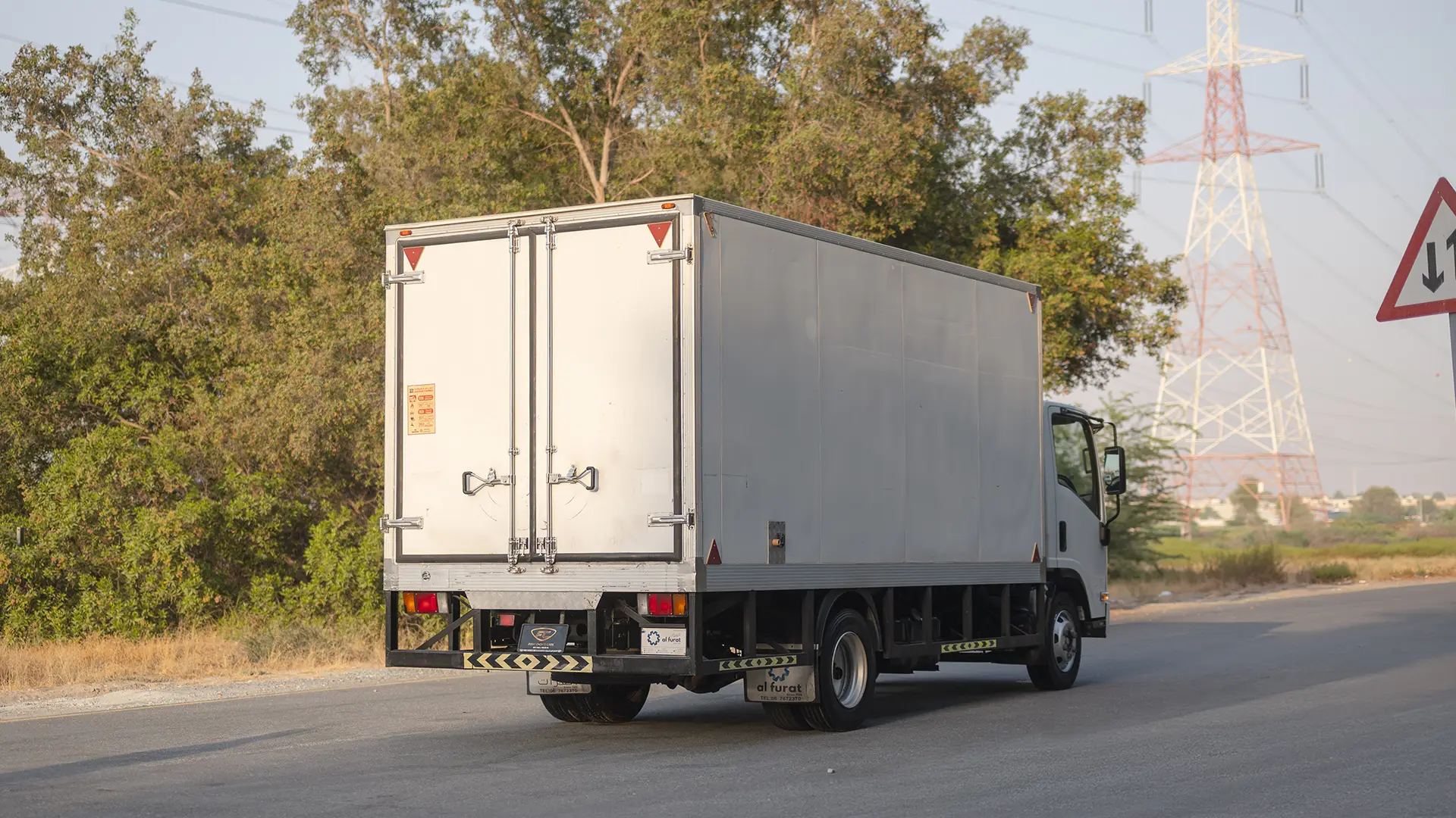 Used 2023 Isuzu Reward Chiller in White – Right Back Diagonal (45°) View for Sale at First Choice Cars Dubai Sharjah