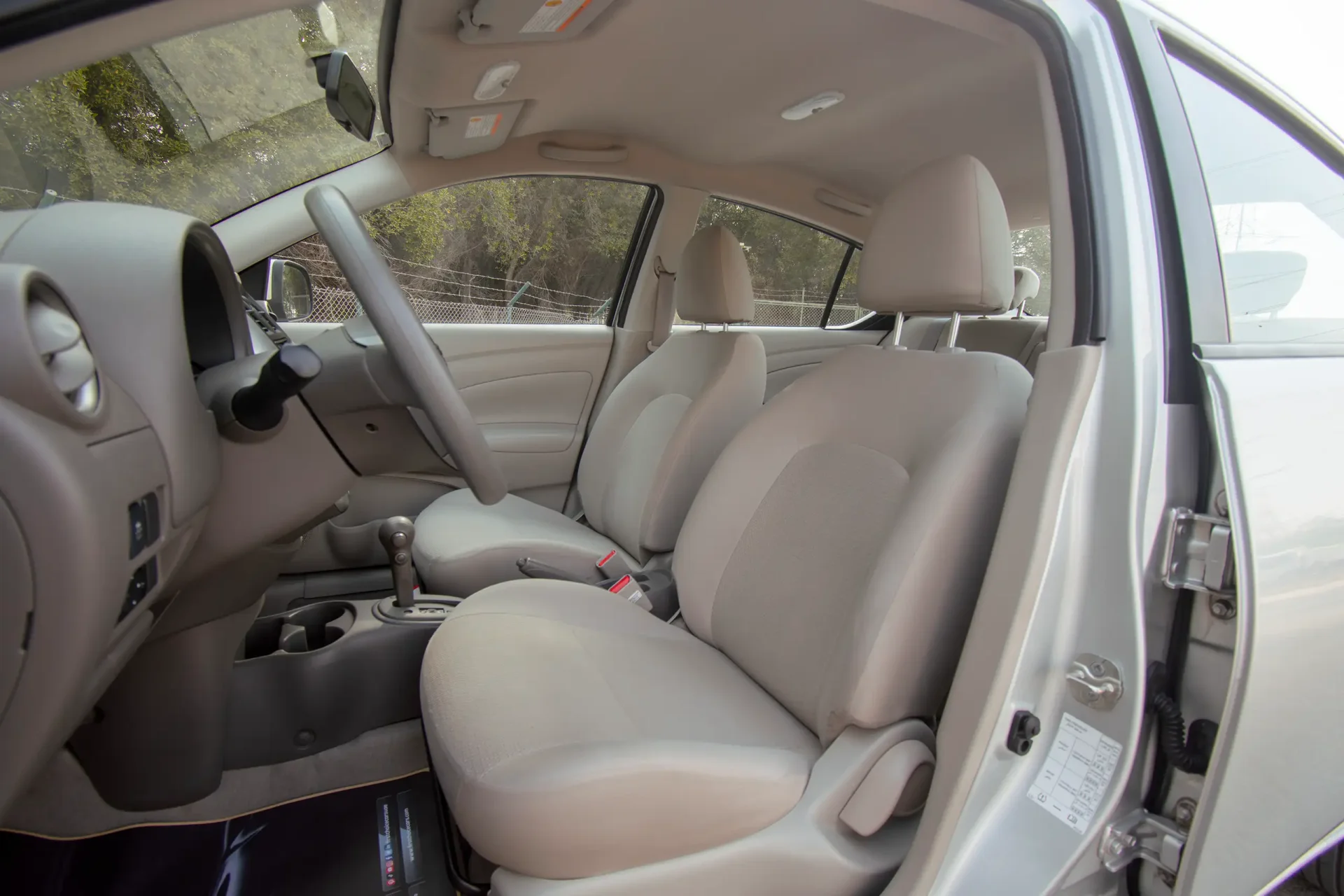 Used 2023 Nissan Sunny SV in Silver – Front Driver Side Cabin View for Sale at First Choice Cars Dubai Sharjah