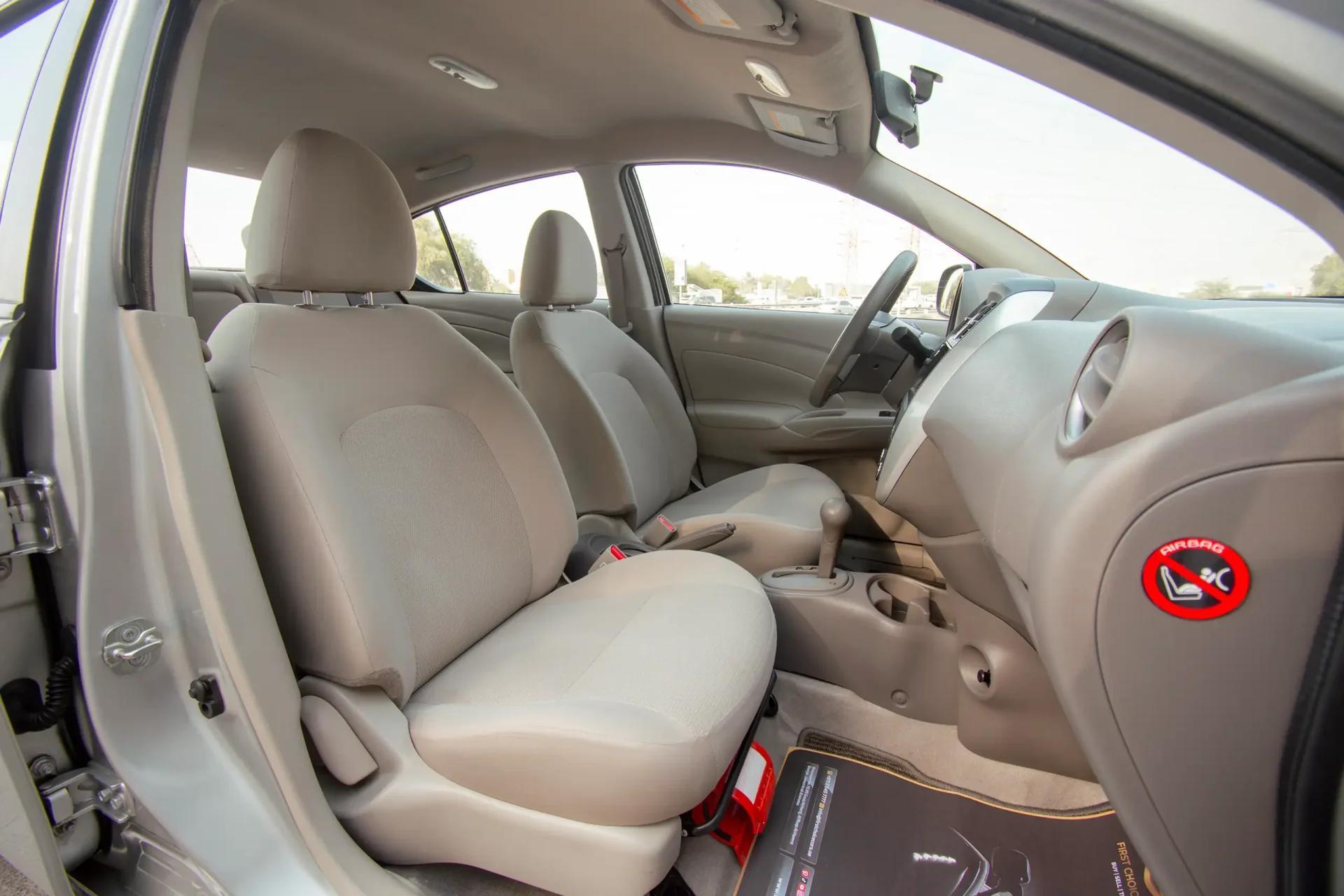 Used 2023 Nissan Sunny SV in Silver – Front Passenger Side Cabin View for Sale at First Choice Cars Dubai Sharjah
