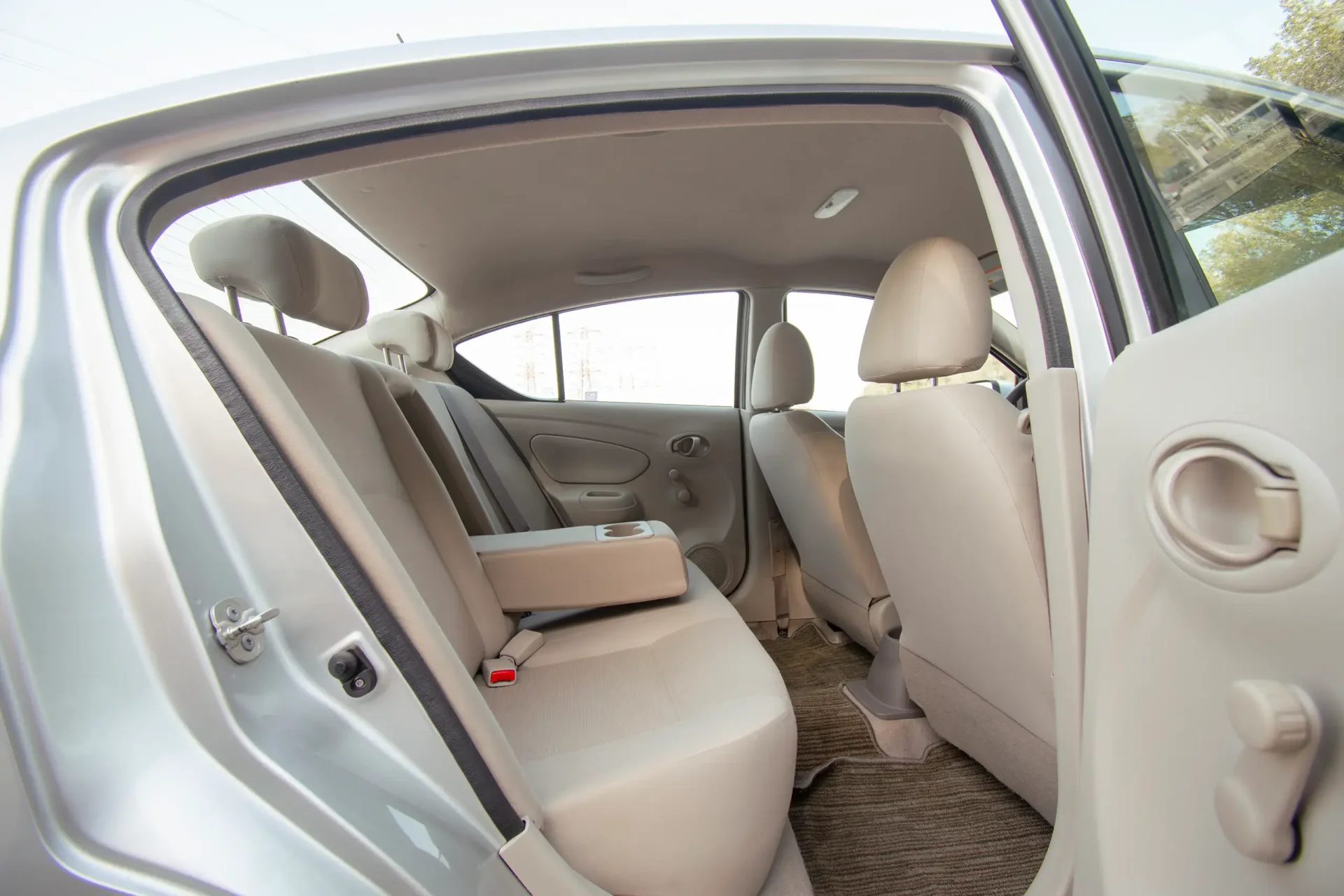 Used 2023 Nissan Sunny SV in Silver – Rear Passenger Side Cabin View for Sale at First Choice Cars Dubai Sharjah