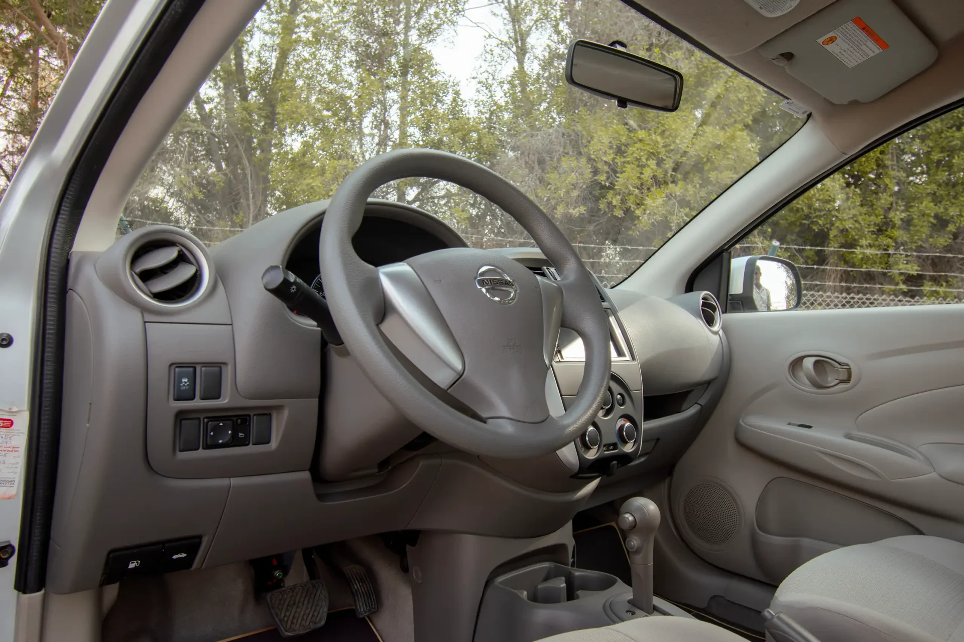 Used 2023 Nissan Sunny SV in Silver – Driver Side Dashboard & Steering View for Sale at First Choice Cars Dubai Sharjah