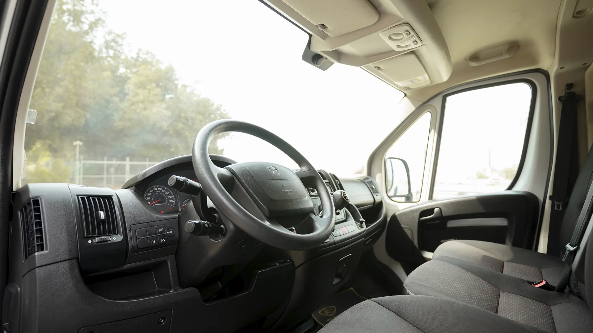Used 2023 Peugeot Boxer L2h2 in White – Driver Side Dashboard & Steering View for Sale at First Choice Cars Dubai Sharjah