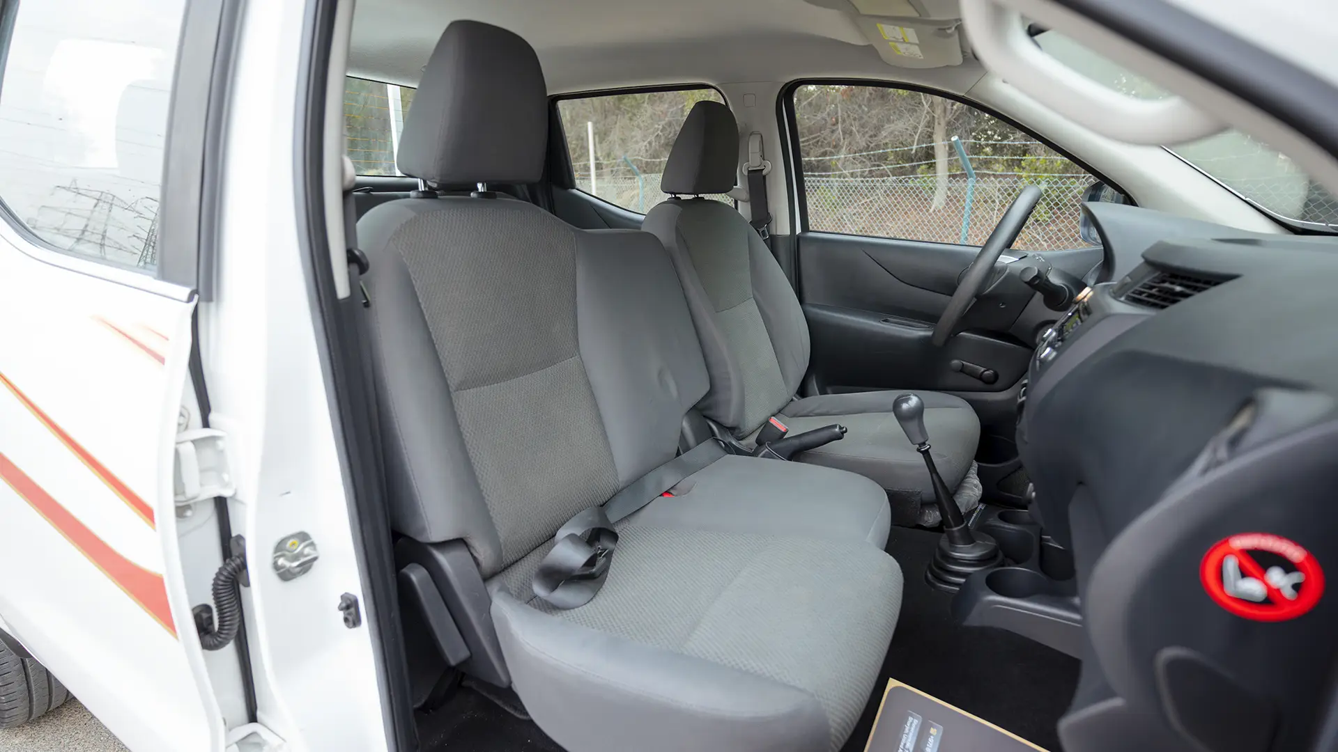 Used 2022 Nissan Navara SE in White – Front Passenger Side Cabin View for Sale at First Choice Cars Dubai Sharjah