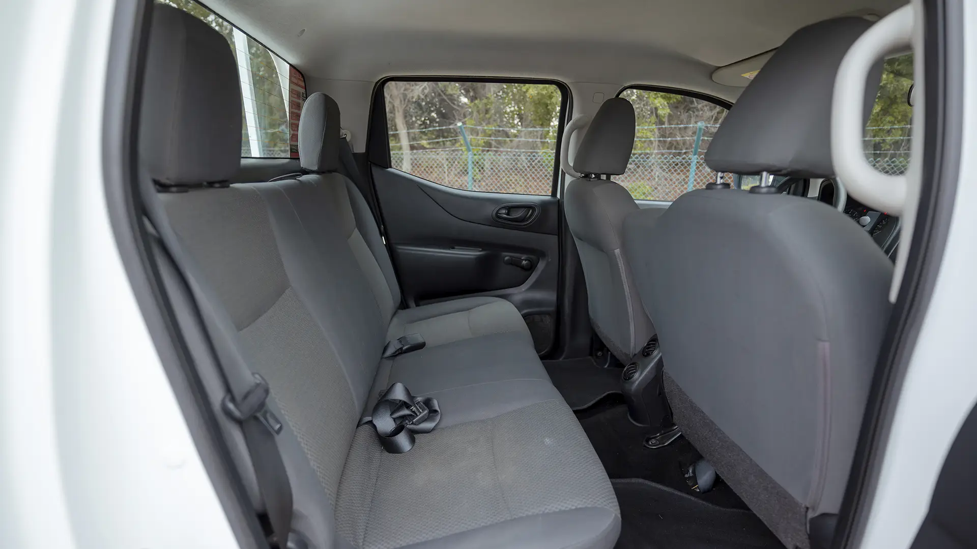 Used 2022 Nissan Navara SE in White – Rear Passenger Side Cabin View for Sale at First Choice Cars Dubai Sharjah