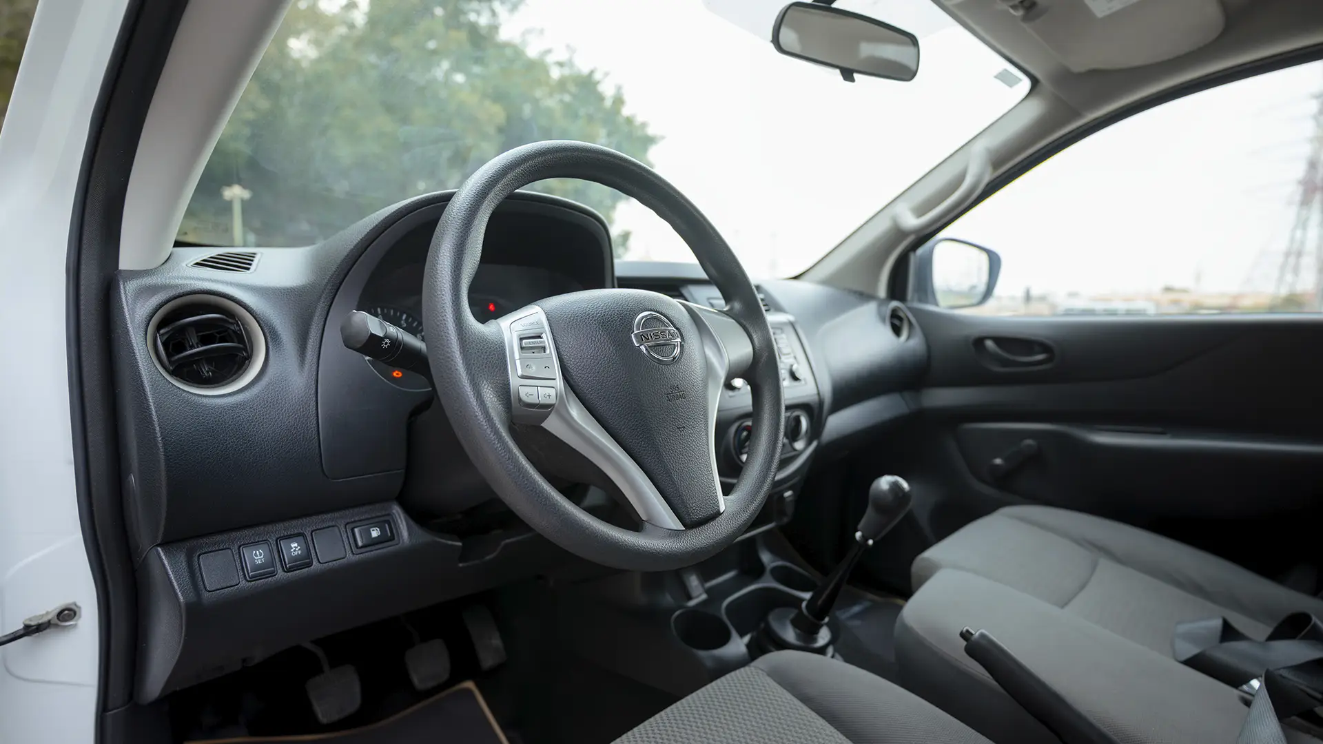Used 2022 Nissan Navara SE in White – Driver Side Dashboard & Steering View for Sale at First Choice Cars Dubai Sharjah