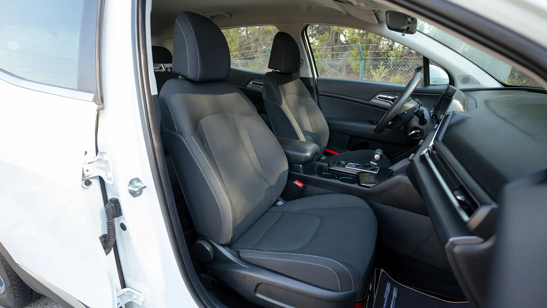 Used 2023 Kia Sportage EX in White – Front Passenger Side Cabin View for Sale at First Choice Cars Dubai Sharjah