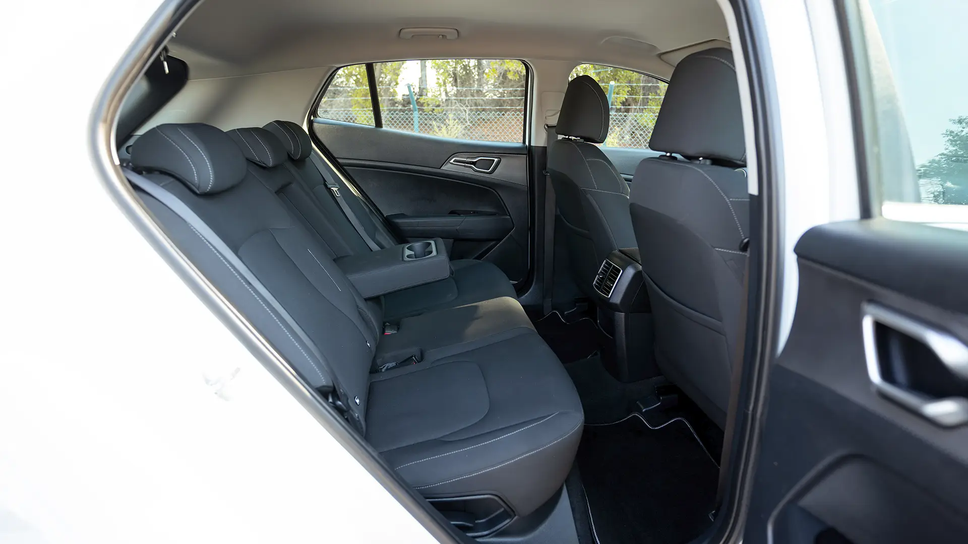 Used 2023 Kia Sportage EX in White – Rear Passenger Side Cabin View for Sale at First Choice Cars Dubai Sharjah