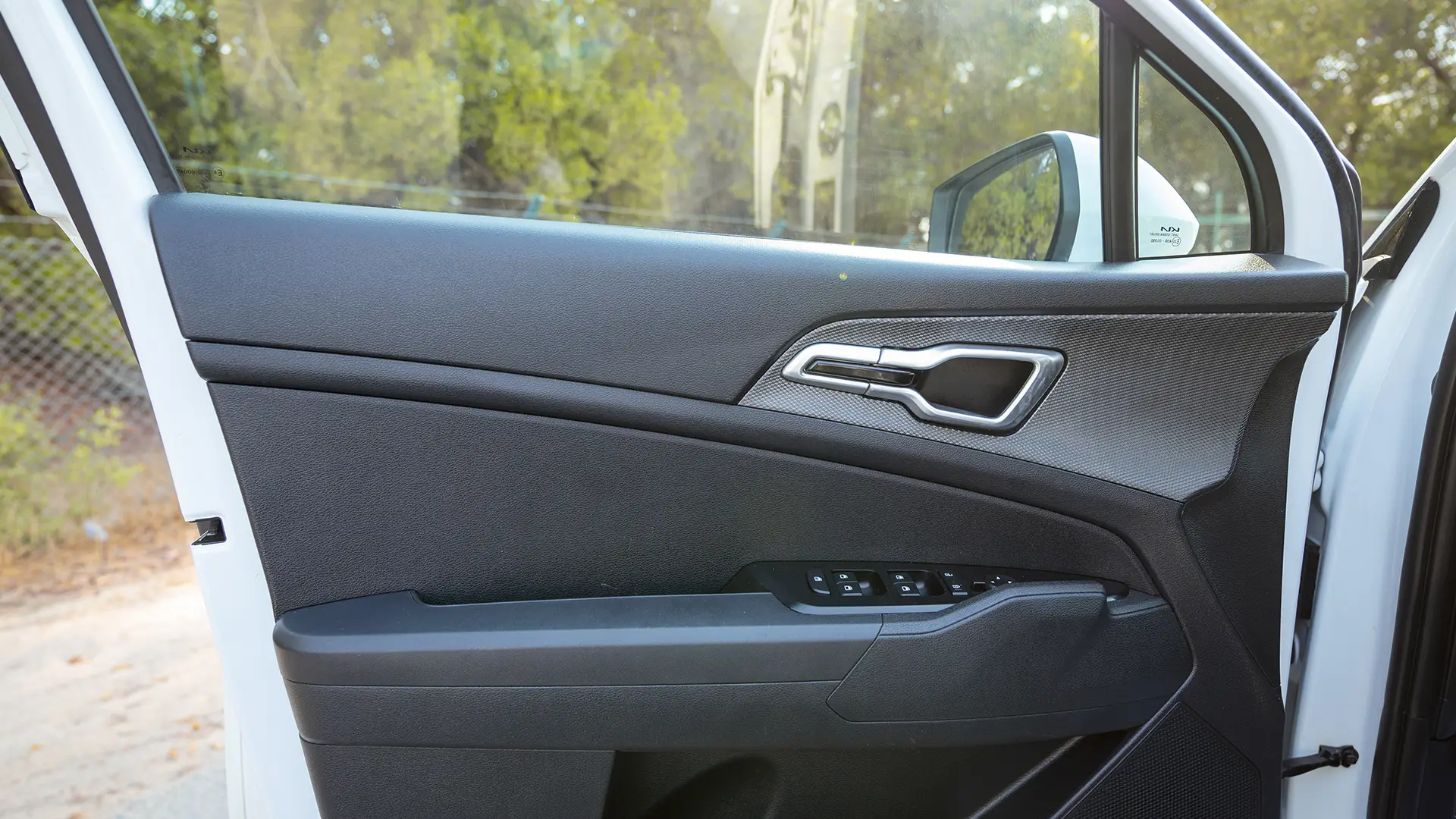 Used 2023 Kia Sportage EX in White – Driver Door Panel Full View for Sale at First Choice Cars Dubai Sharjah