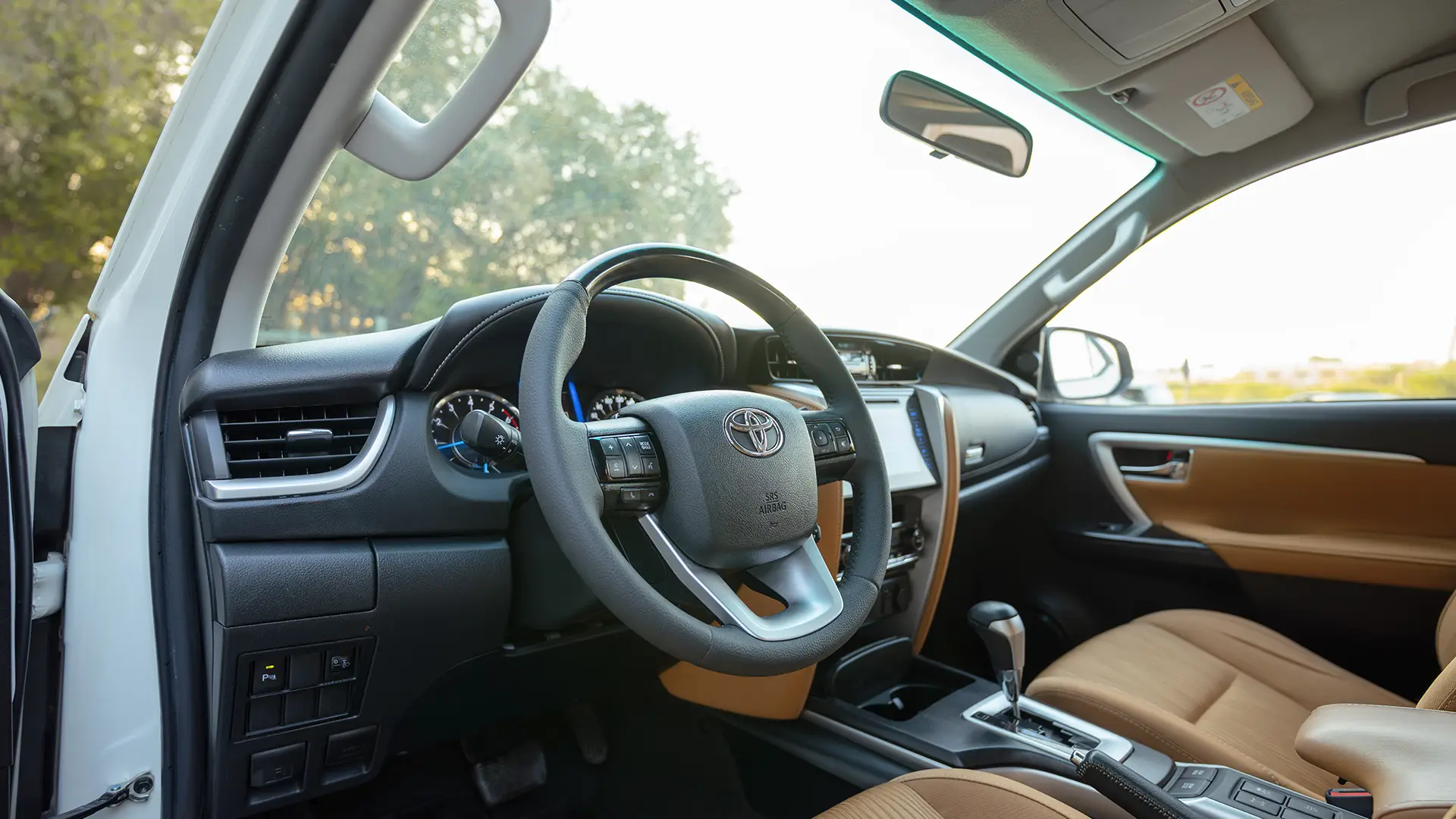 Used 2020 Toyota Fortuner GXR in White – Driver Side Dashboard & Steering View for Sale at First Choice Cars Dubai Sharjah