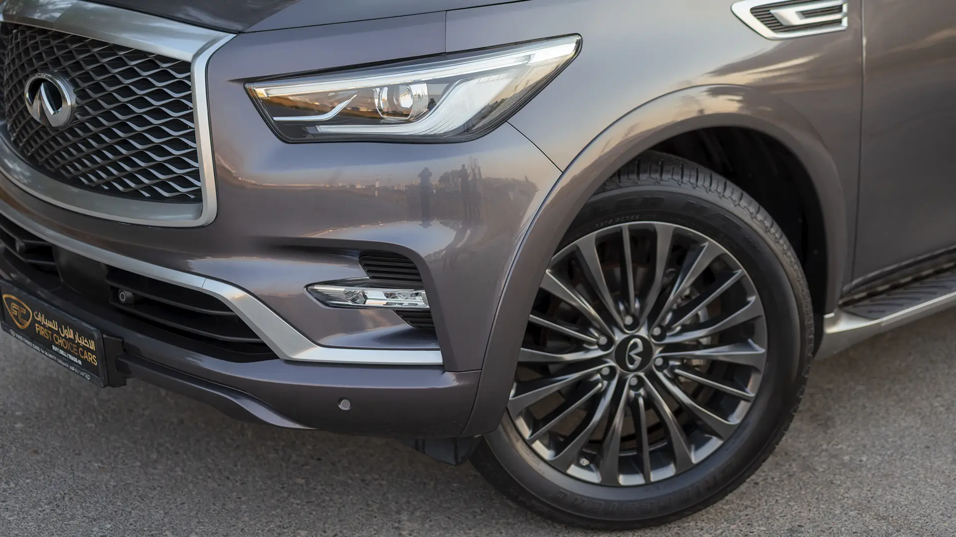 Used 2023 Infiniti QX80 Sensory in Grey – Headlight Close-up for Sale at First Choice Cars Dubai Sharjah