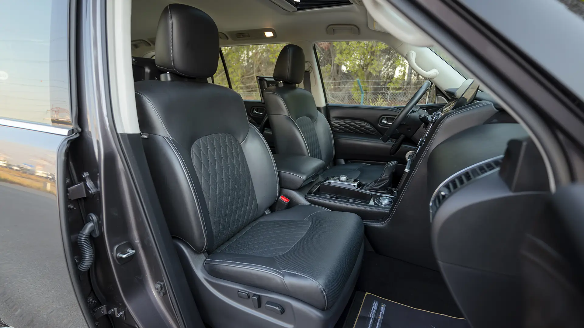 Used 2023 Infiniti QX80 Sensory in Grey – Front Passenger Side Cabin View for Sale at First Choice Cars Dubai Sharjah