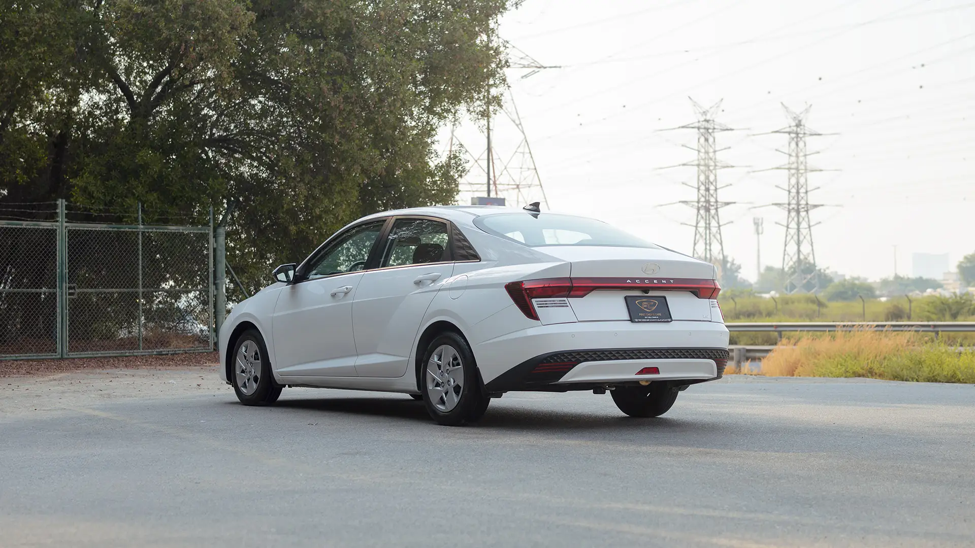 Used 2025 Hyundai Accent Smart in White – Left Back Diagonal (45°) View for Sale at First Choice Cars Dubai Sharjah