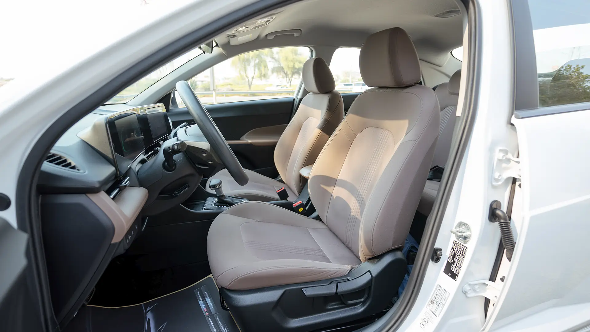 Used 2025 Hyundai Accent Smart in White – Front Driver Side Cabin View for Sale at First Choice Cars Dubai Sharjah