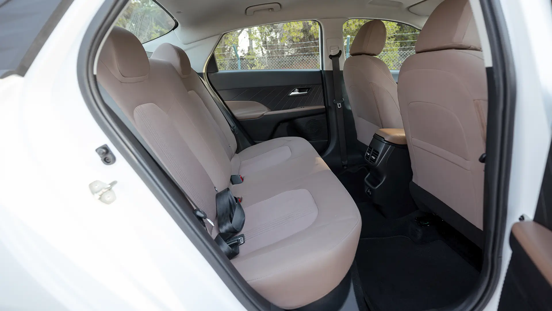 Used 2025 Hyundai Accent Smart in White – Rear Passenger Side Cabin View for Sale at First Choice Cars Dubai Sharjah
