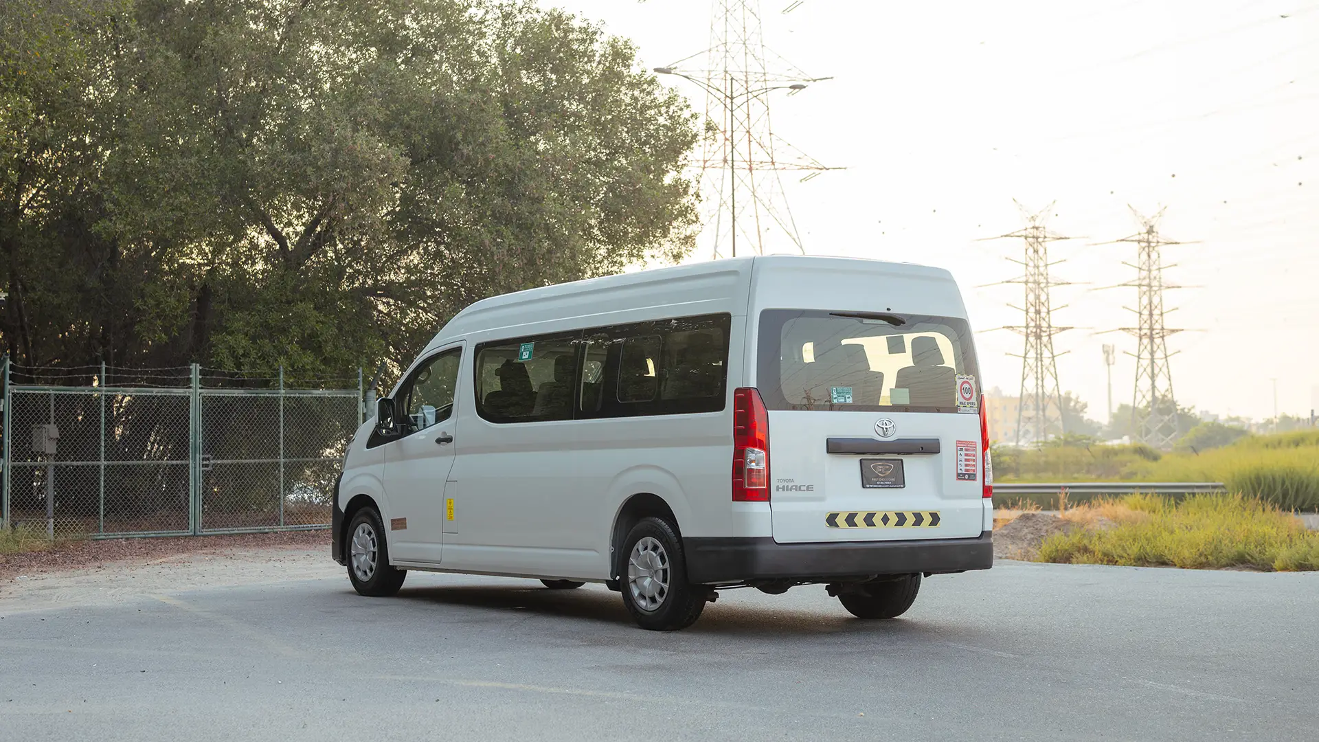 Used 2022 Toyota Hiace GL High Roof in White – Left Back Diagonal (45°) View for Sale at First Choice Cars Dubai Sharjah
