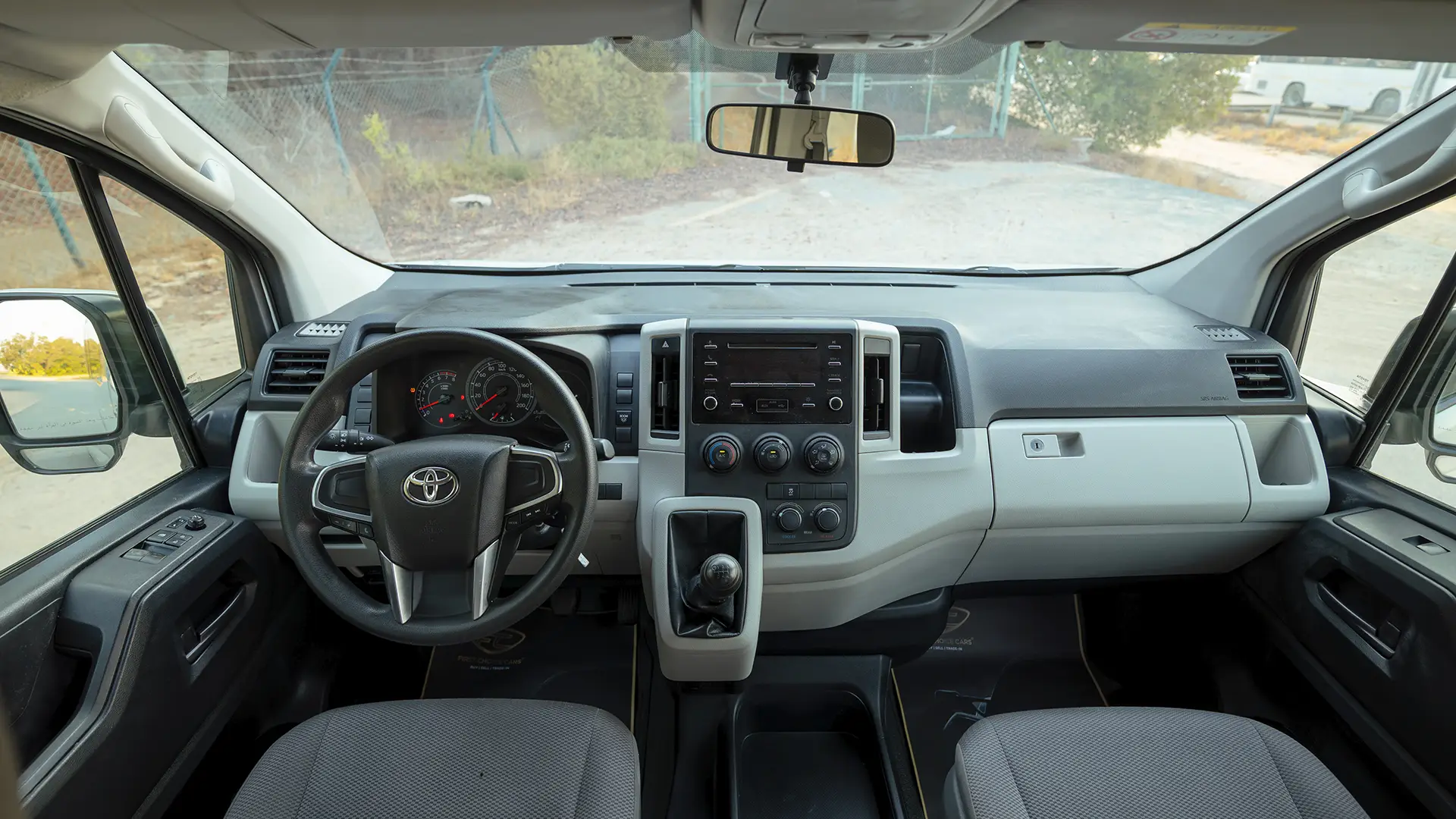 Used 2022 Toyota Hiace GL High Roof in White – Front Cabin / Dashboard Full View for Sale at First Choice Cars Dubai Sharjah