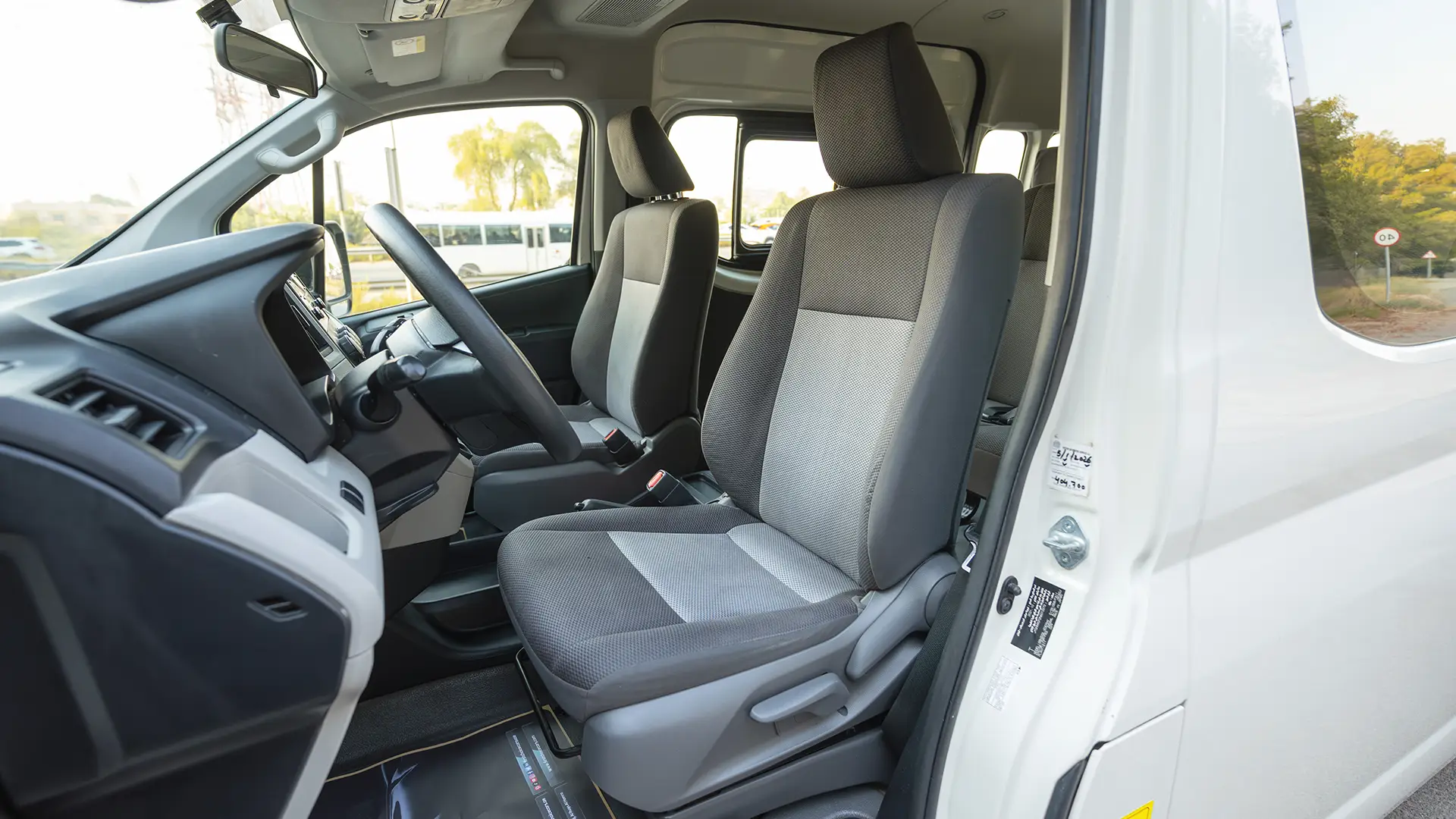 Used 2022 Toyota Hiace GL High Roof in White – Front Driver Side Cabin View for Sale at First Choice Cars Dubai Sharjah