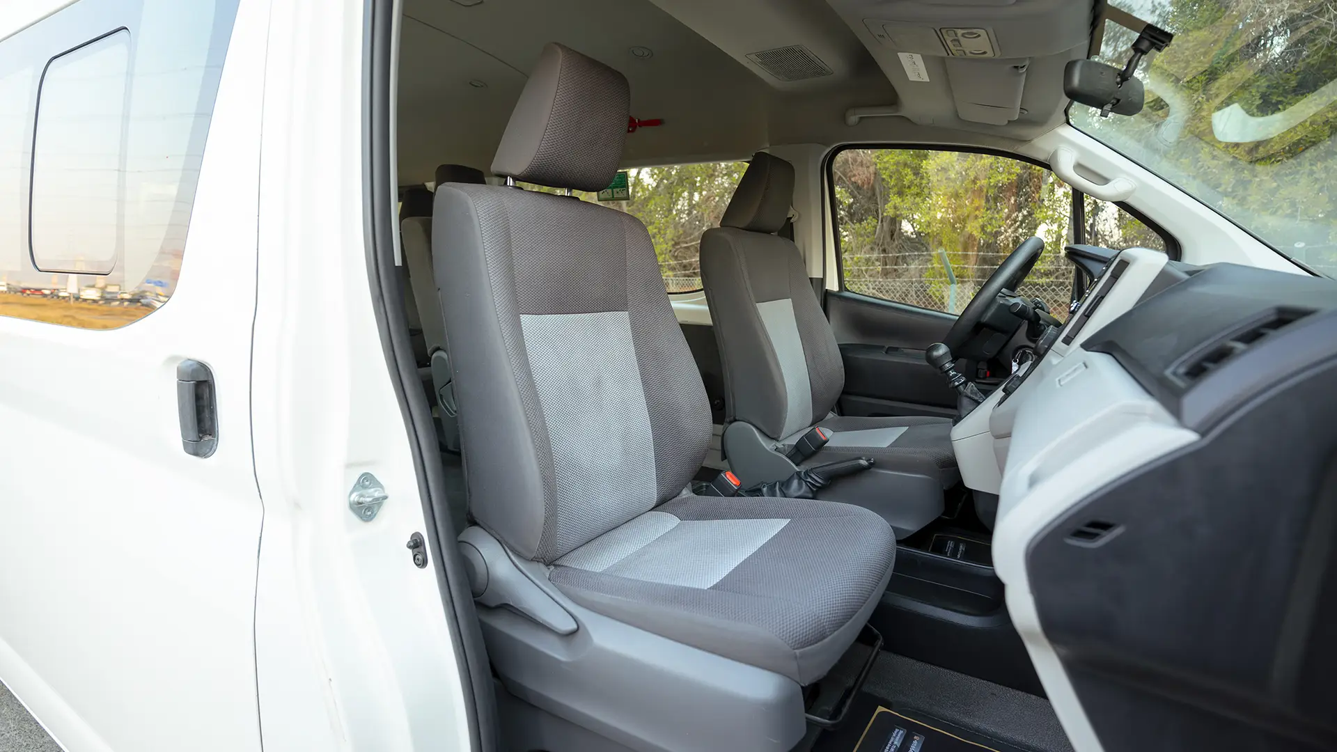 Used 2022 Toyota Hiace GL High Roof in White – Front Passenger Side Cabin View for Sale at First Choice Cars Dubai Sharjah