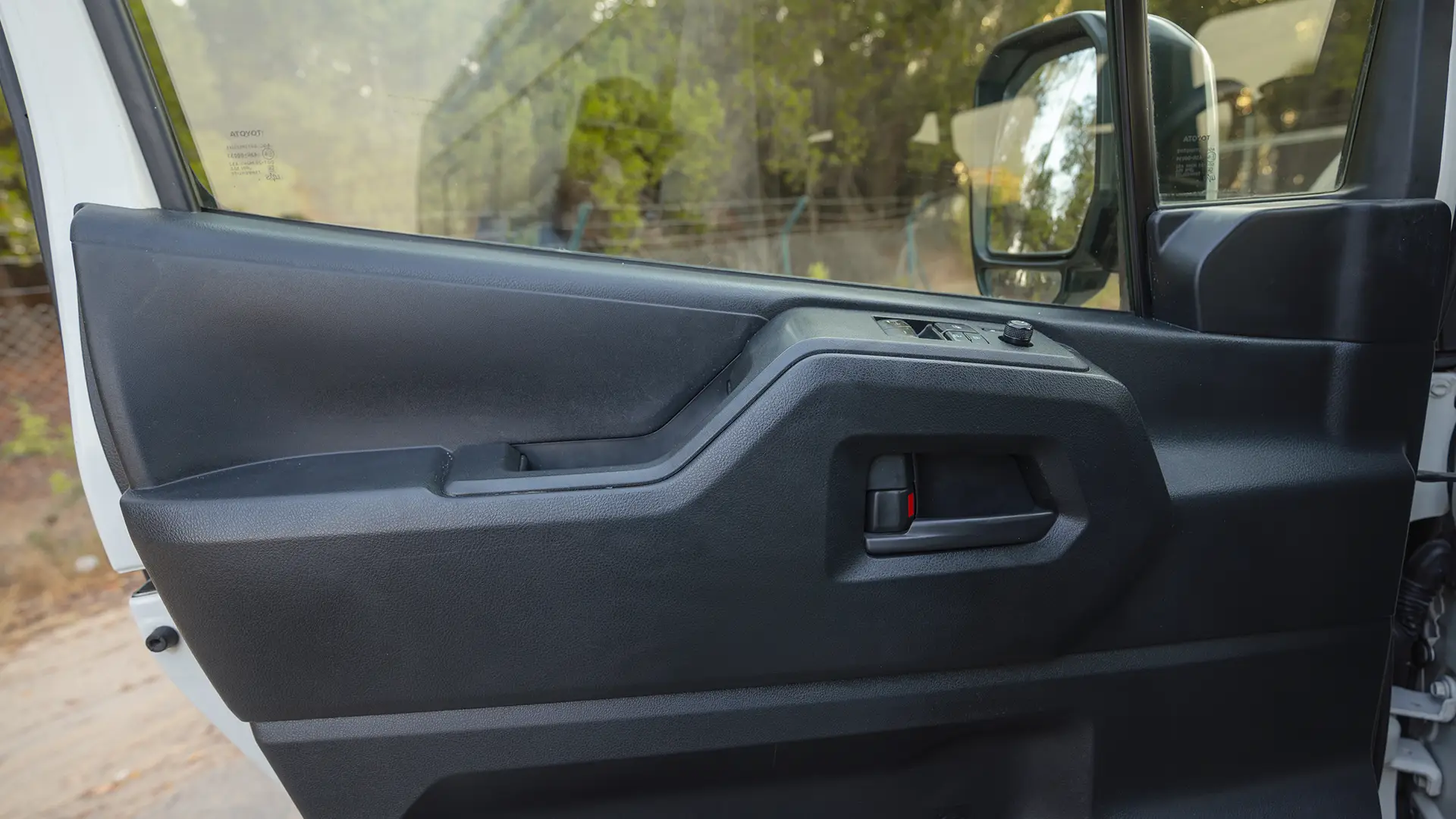 Used 2022 Toyota Hiace GL High Roof in White – Driver Door Panel Full View for Sale at First Choice Cars Dubai Sharjah