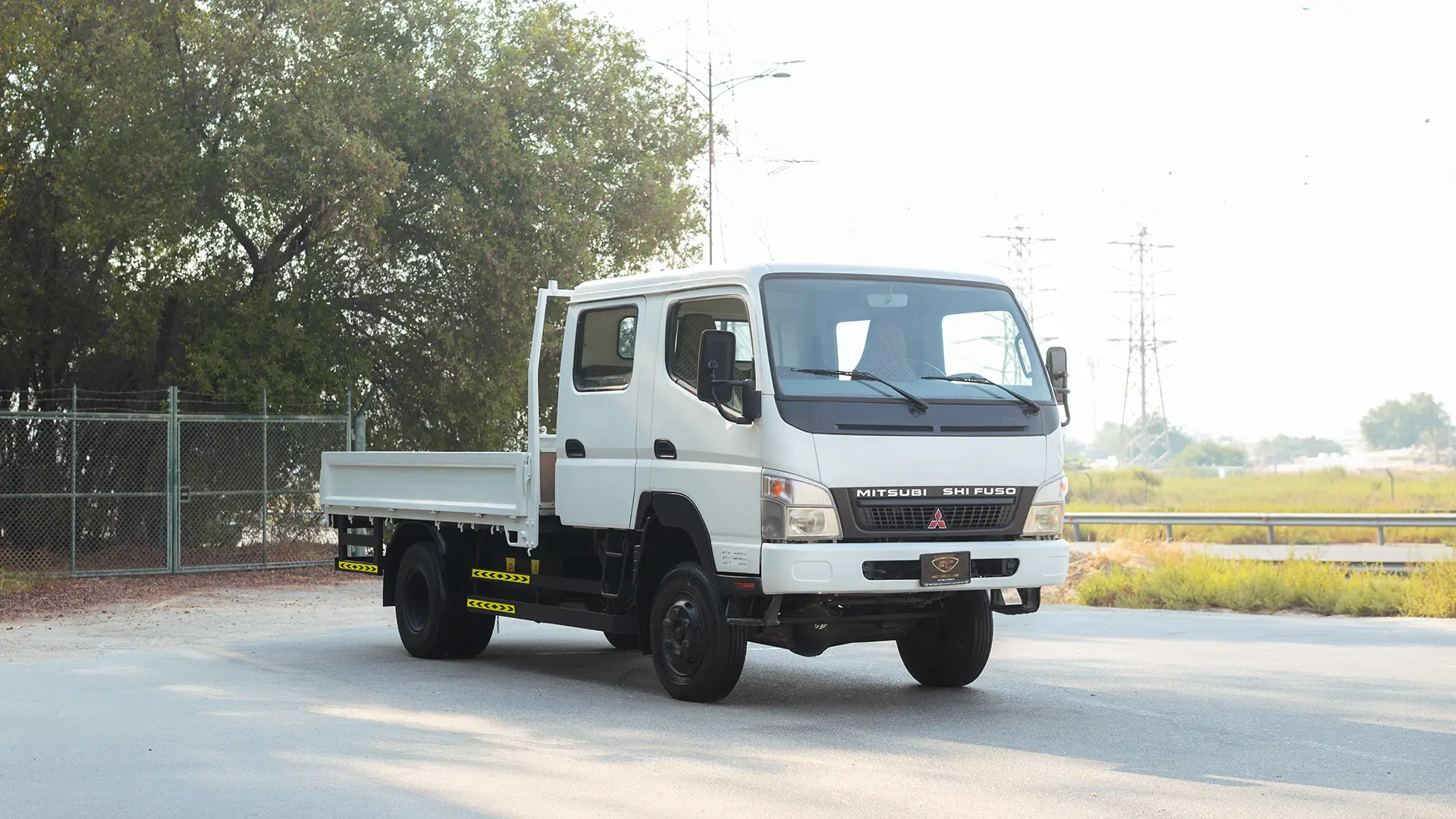 Used 2016 Mitsubishi Canter Double Cabin Cargo Body in White – Right Front Diagonal (45°) View for Sale at First Choice Cars Dubai Sharjah