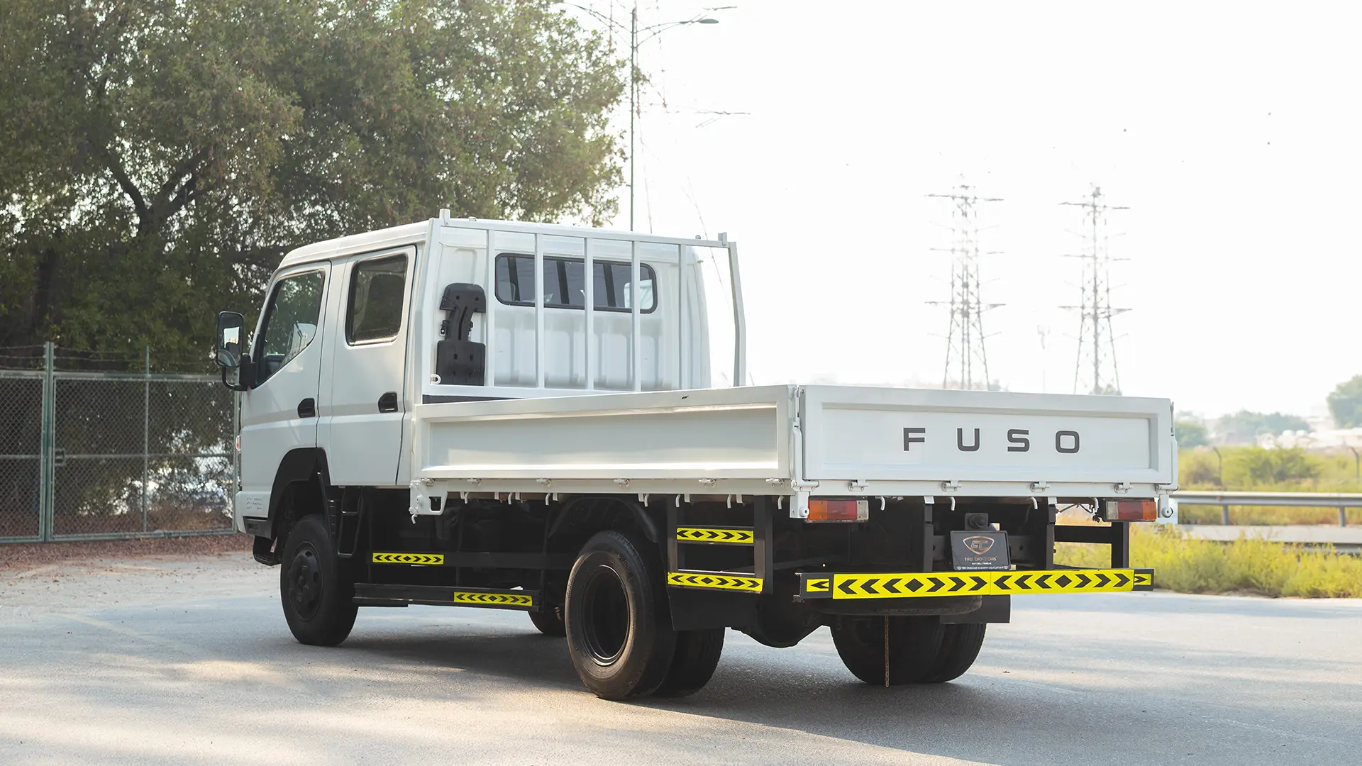 Used 2016 Mitsubishi Canter Double Cabin Cargo Body in White – Left Back Diagonal (45°) View for Sale at First Choice Cars Dubai Sharjah