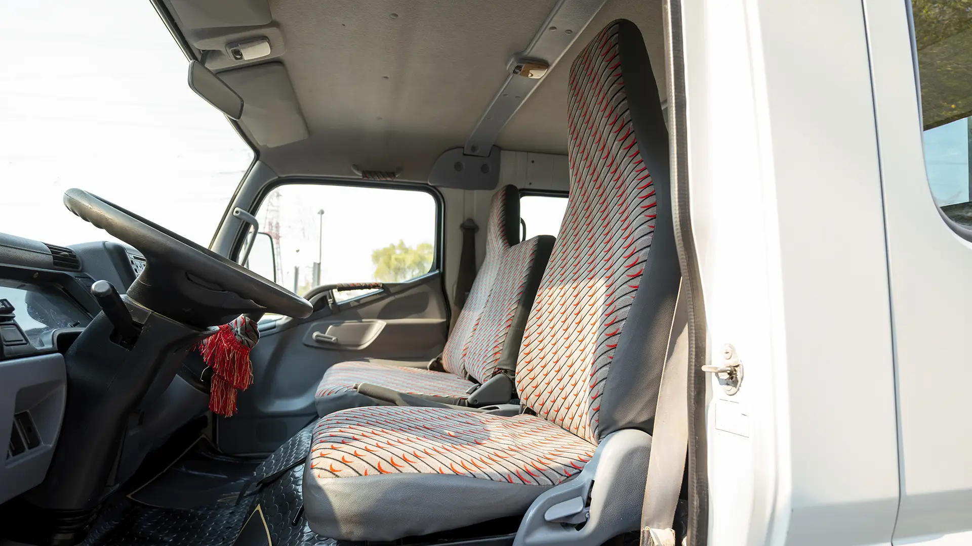 Used 2016 Mitsubishi Canter Double Cabin Cargo Body in White – Front Driver Side Cabin View for Sale at First Choice Cars Dubai Sharjah