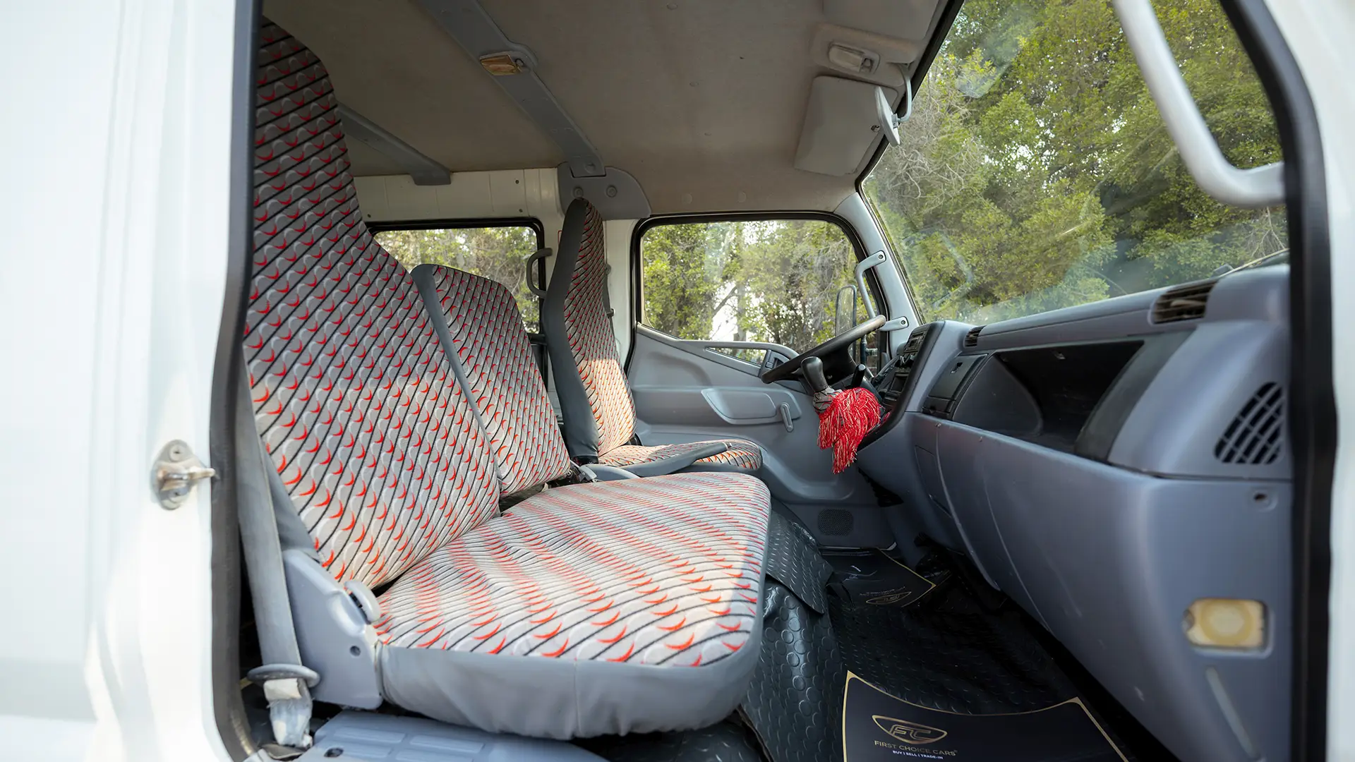 Used 2016 Mitsubishi Canter Double Cabin Cargo Body in White – Front Passenger Side Cabin View for Sale at First Choice Cars Dubai Sharjah