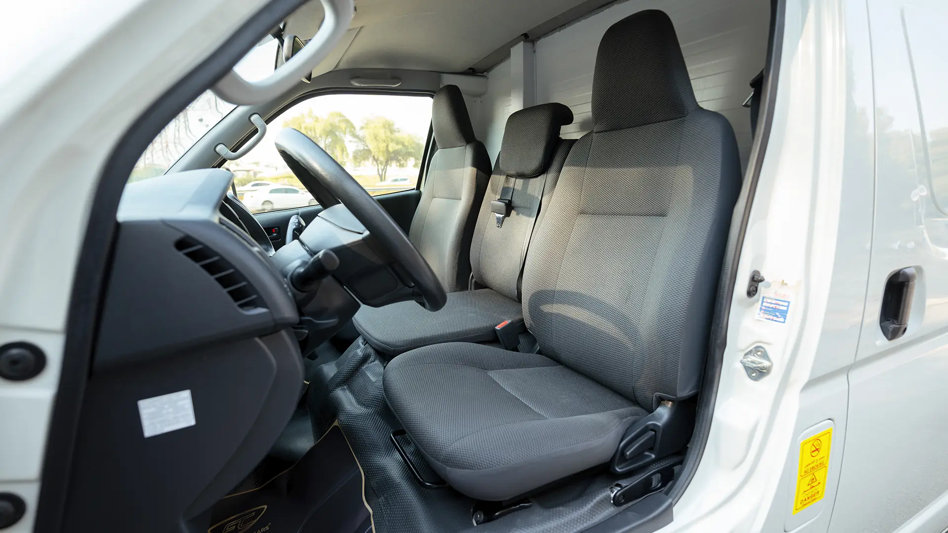 Used 2024 Toyota Hiace GL Standard Roof in White – Front Driver Side Cabin View for Sale at First Choice Cars Dubai Sharjah