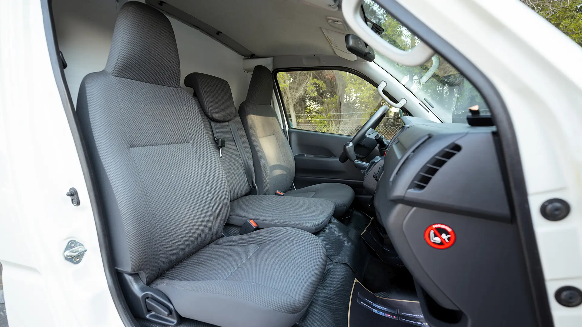 Used 2024 Toyota Hiace GL Standard Roof in White – Front Passenger Side Cabin View for Sale at First Choice Cars Dubai Sharjah