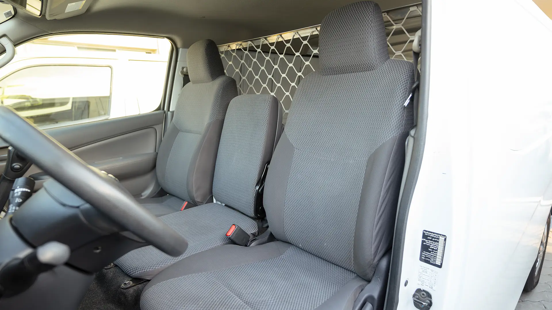 Used 2022 Nissan Urvan Standard Roof in White – Front Driver Side Cabin View for Sale at First Choice Cars Dubai Sharjah