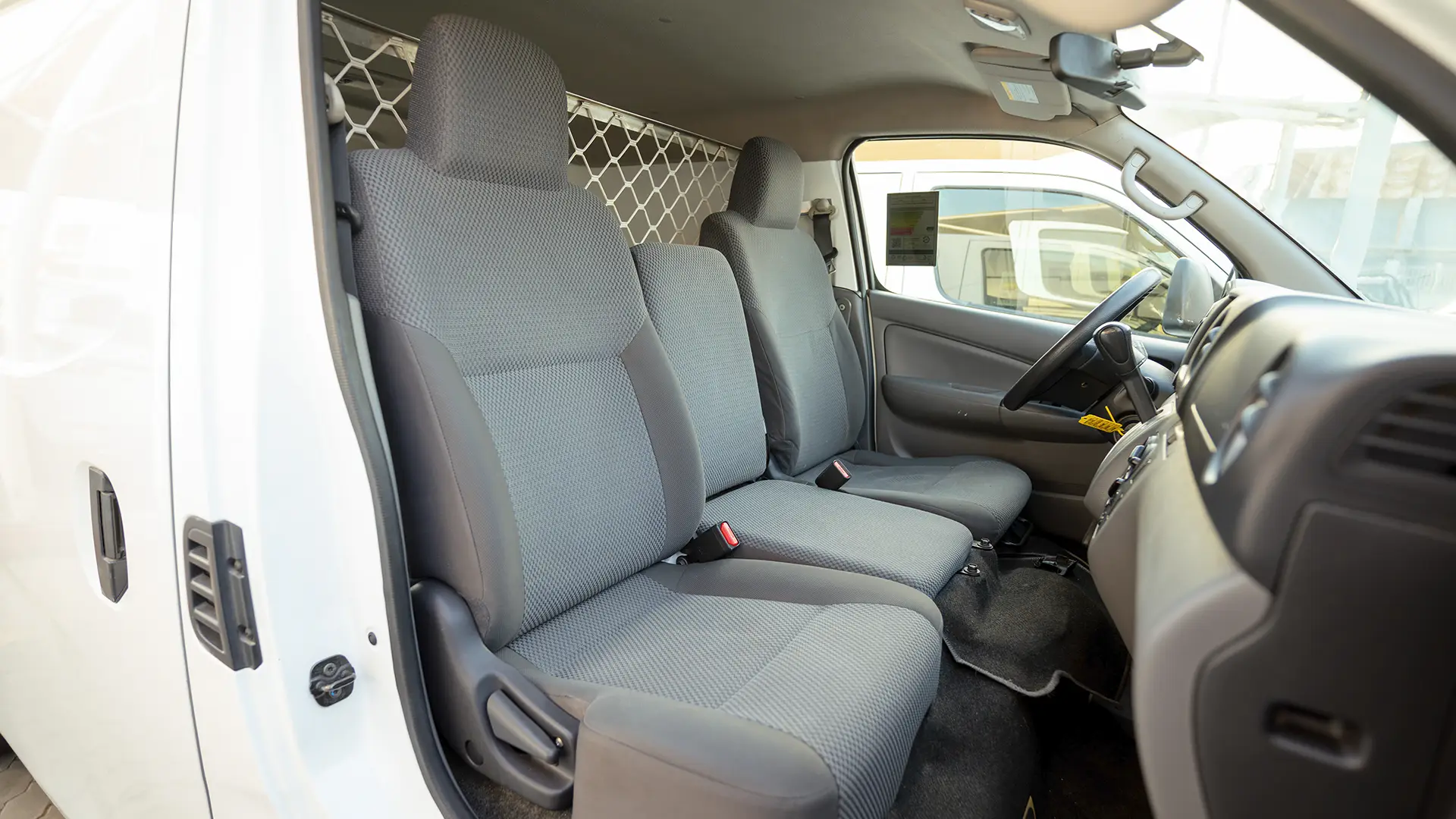 Used 2022 Nissan Urvan Standard Roof in White – Front Passenger Side Cabin View for Sale at First Choice Cars Dubai Sharjah