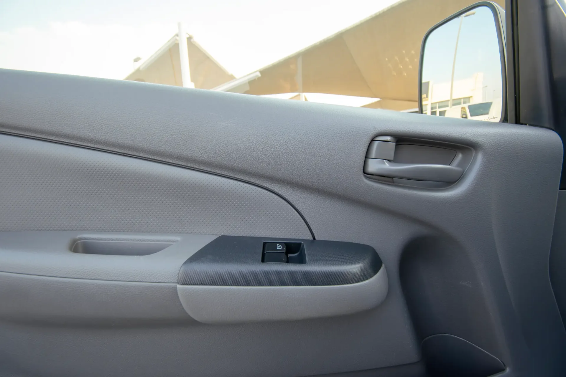 Used 2022 Nissan Urvan Standard Roof in White – Driver Door Panel Full View for Sale at First Choice Cars Dubai Sharjah