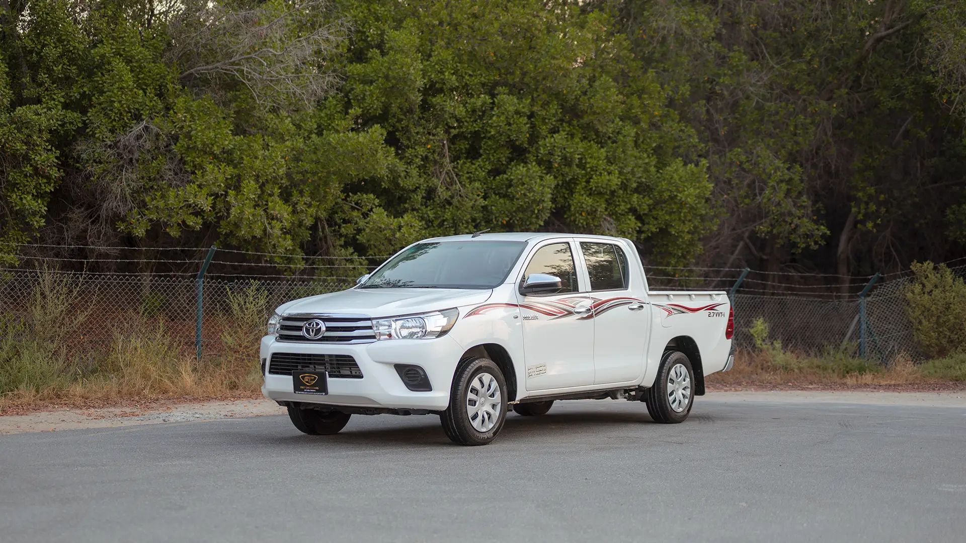 Used 2022 Toyota Hilux GLX Double Cabin in White – Left Front Diagonal (45°) View for Sale at First Choice Cars Dubai Sharjah