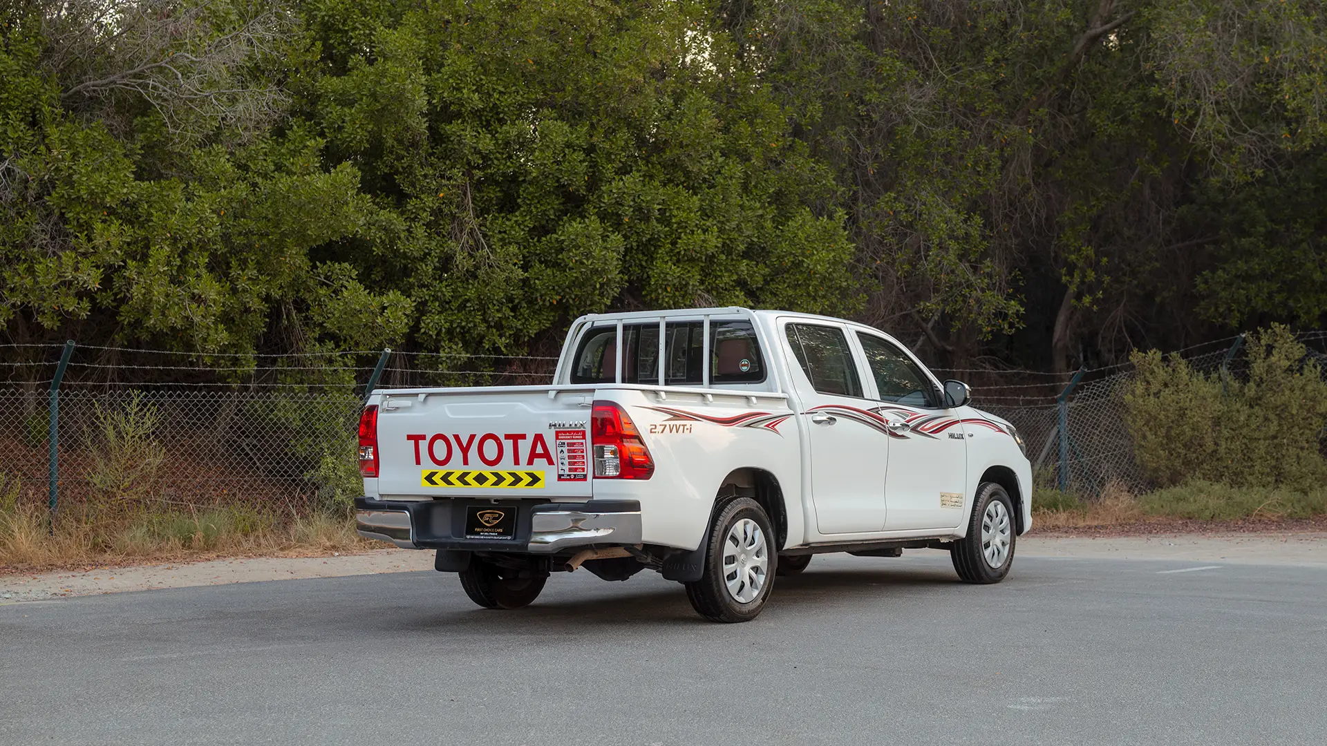 Used 2022 Toyota Hilux GLX Double Cabin in White – Right Back Diagonal (45°) View for Sale at First Choice Cars Dubai Sharjah
