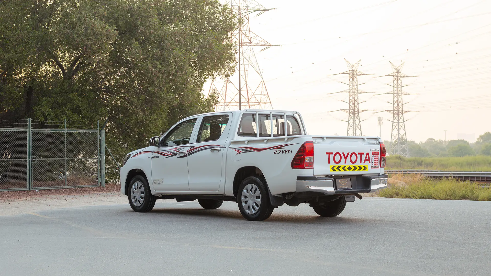 Used 2022 Toyota Hilux GLX Double Cabin in White – Left Back Diagonal (45°) View for Sale at First Choice Cars Dubai Sharjah